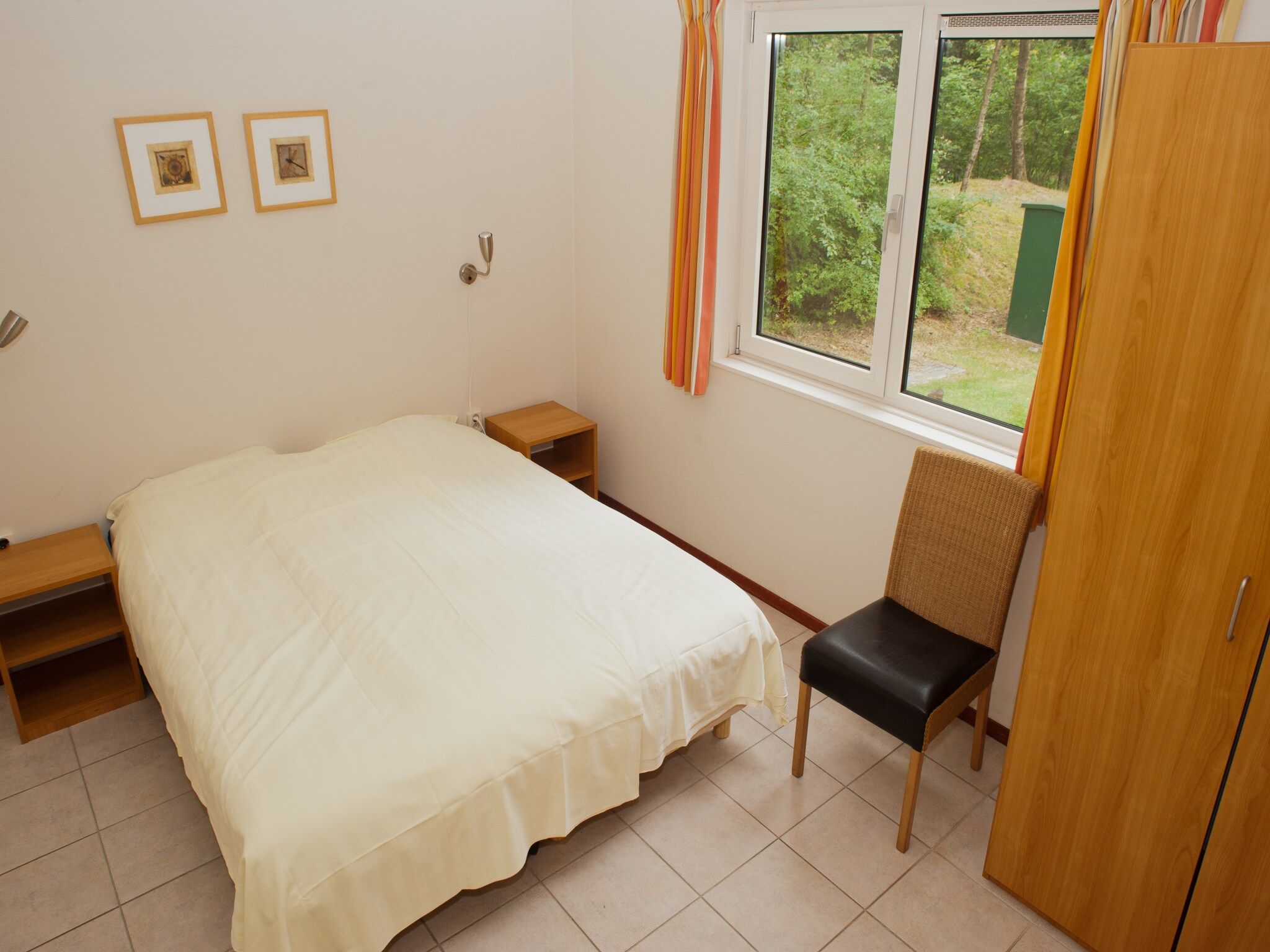 Een slaapkamer van Vakantiepark de Berkenhorst 5 in Kootwijk