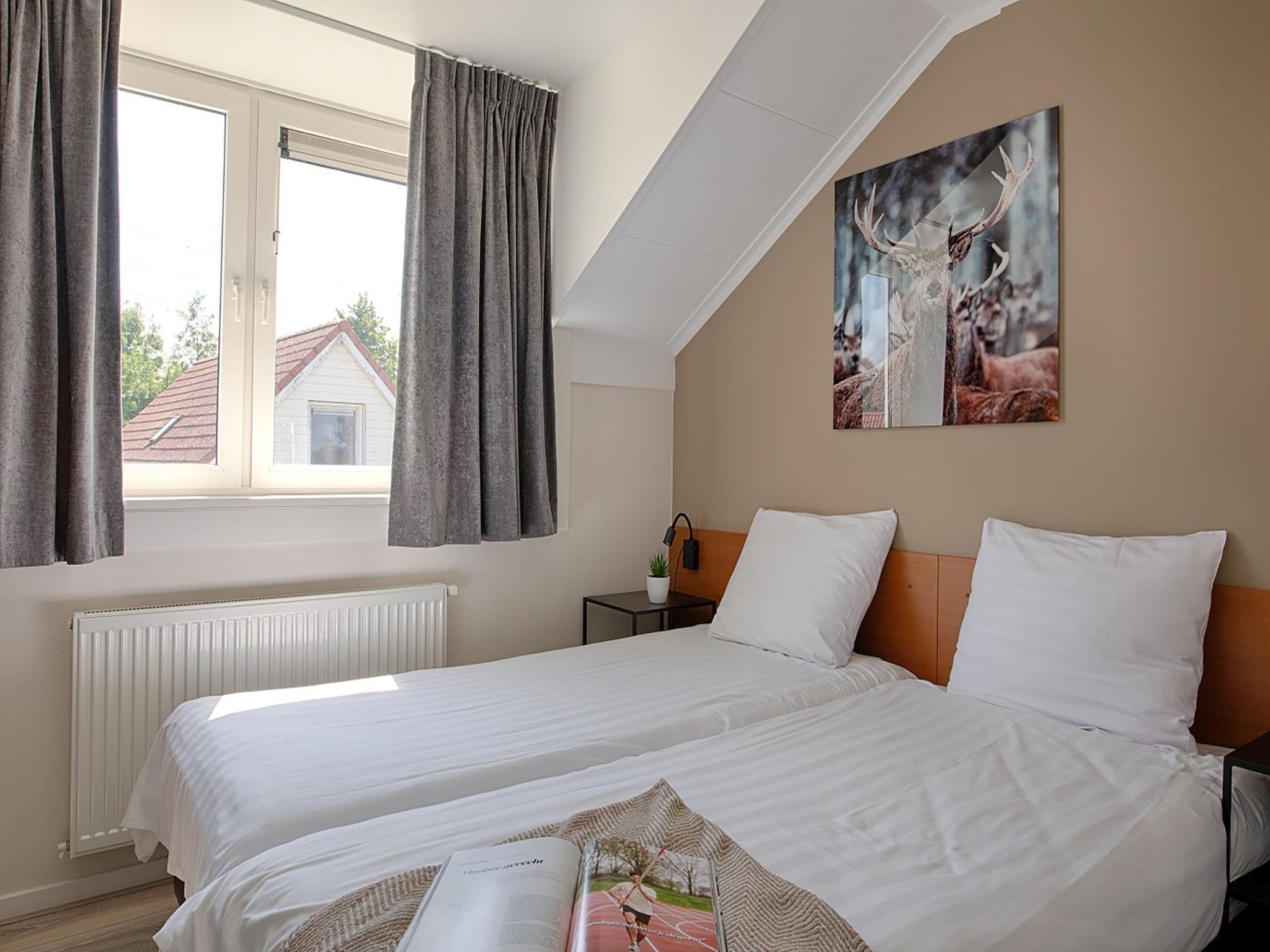 Een slaapkamer van Waterwoning 2-6 persoons in Heel