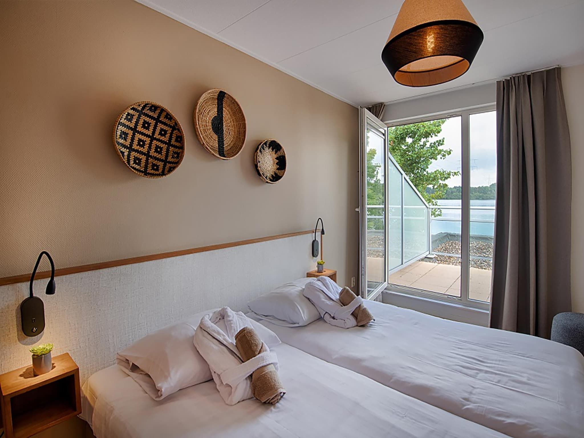 Een slaapkamer van VIP Waterzicht 2-4 persoons in Heel