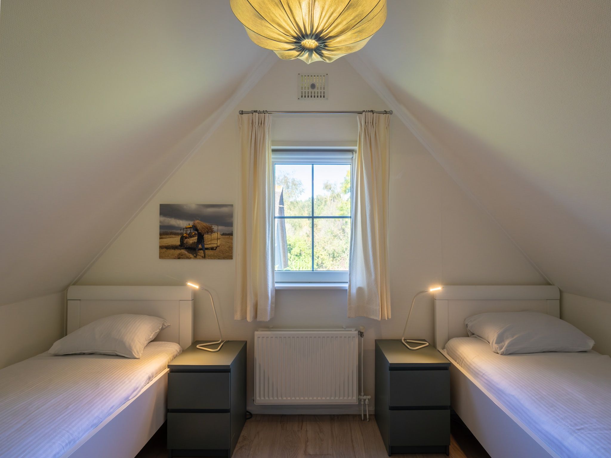 Een slaapkamer van Villapark De Weerribben 2 in Paasloo