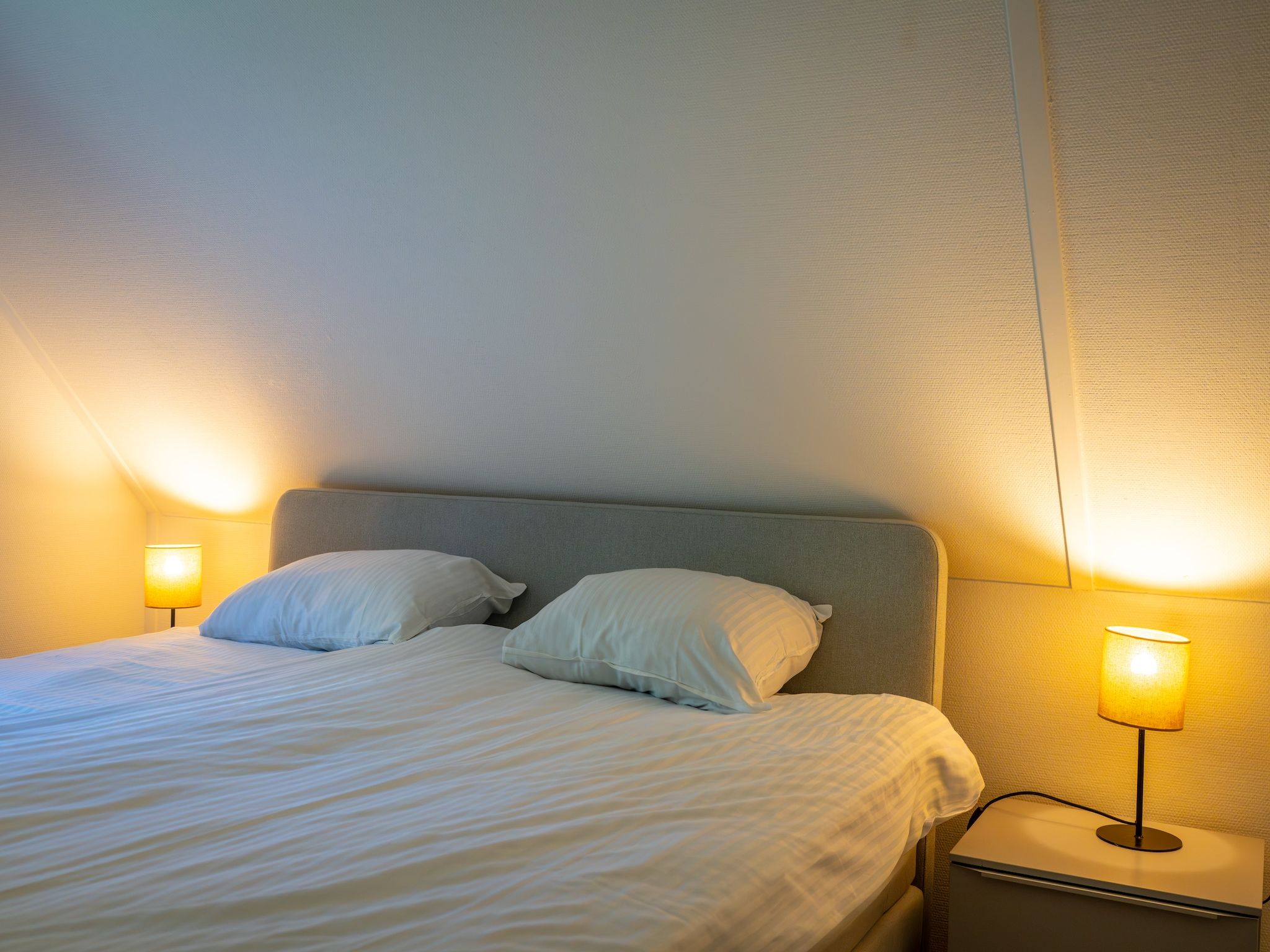 Een slaapkamer van Villapark De Weerribben 2 in Paasloo
