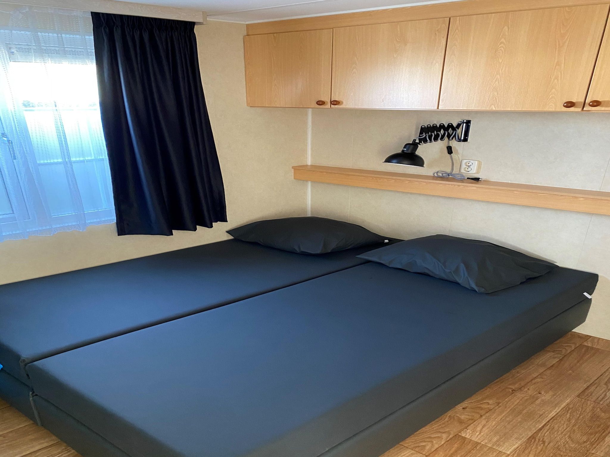 Een slaapkamer van Recreatiepark Duinhoeve 1 in Udenhout