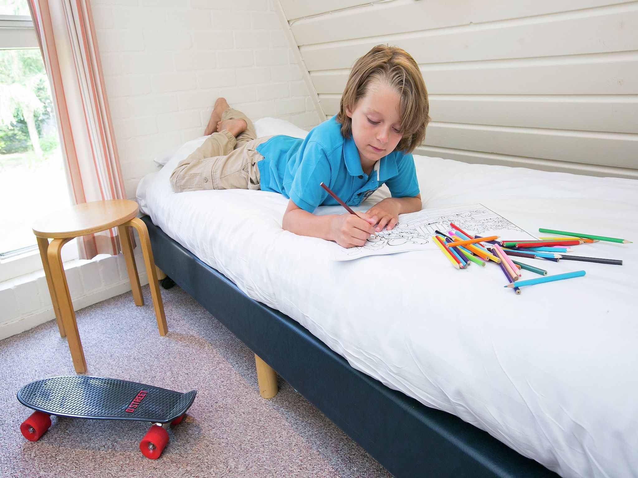 Een slaapkamer van Bungalowpark Hoenderloo 3 in Hoenderloo