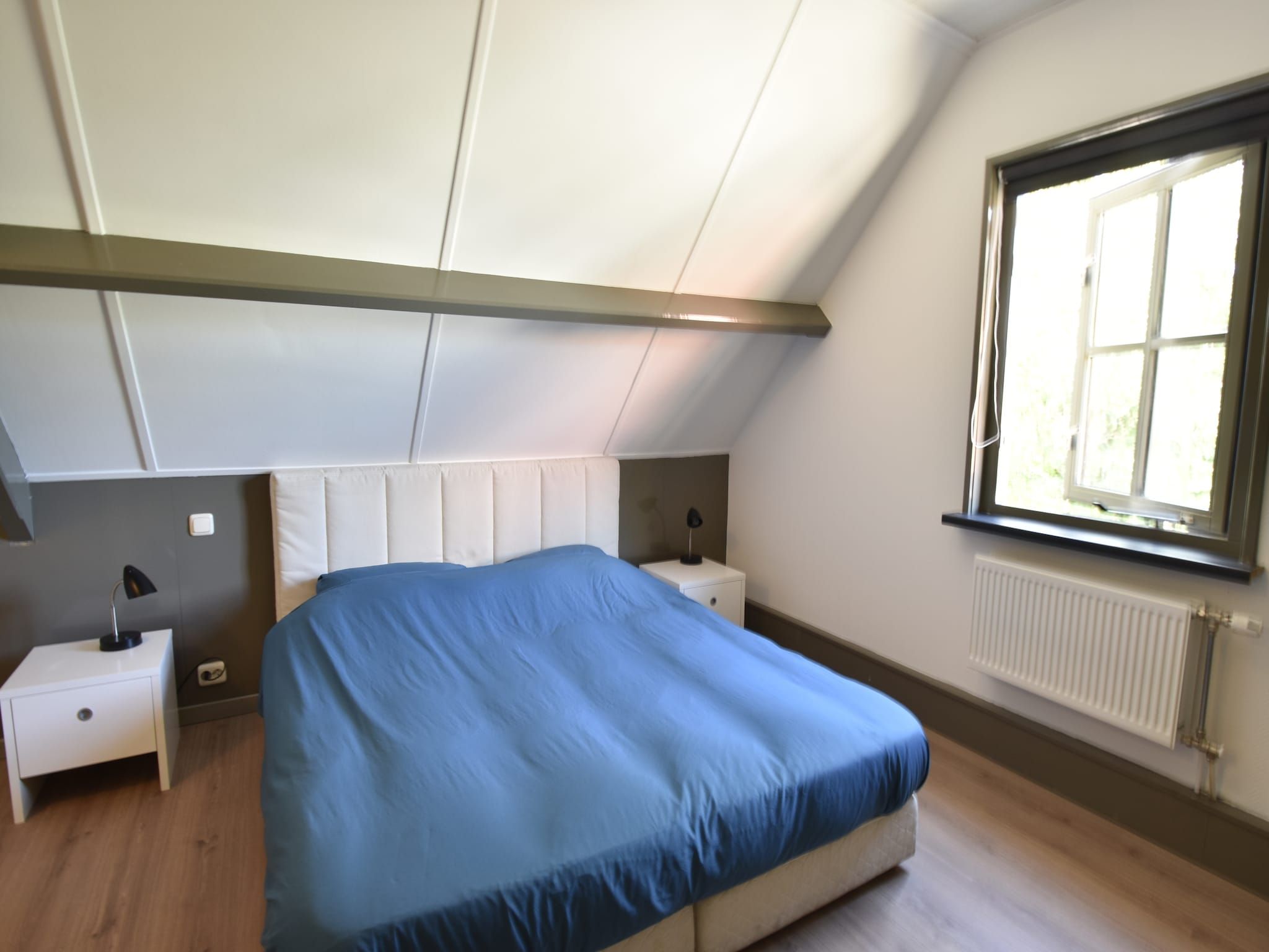Een slaapkamer van Harrekidee in Sint Maartensbrug