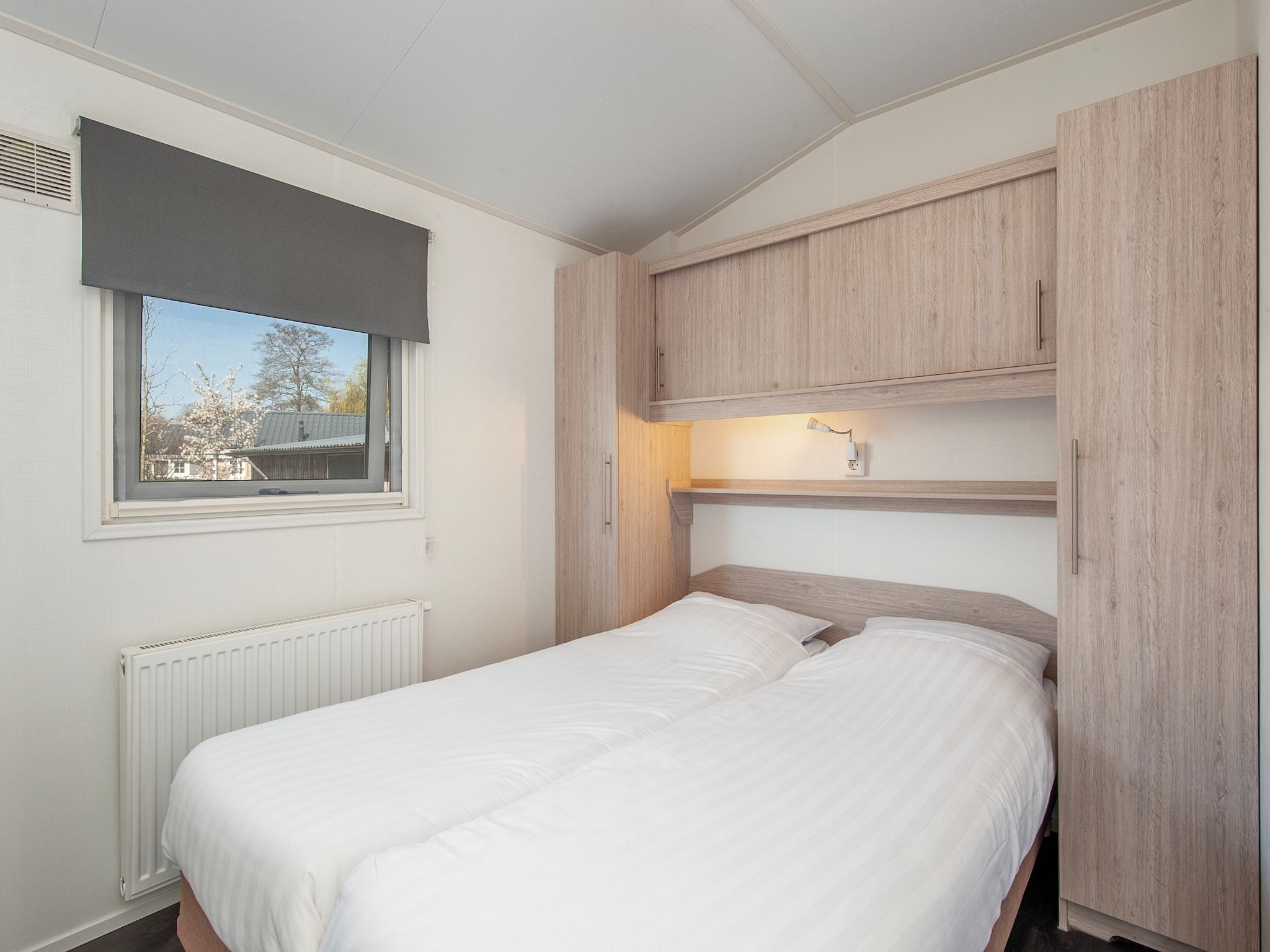 Een slaapkamer van Vakantiepark Giethoorn 3 in Giethoorn