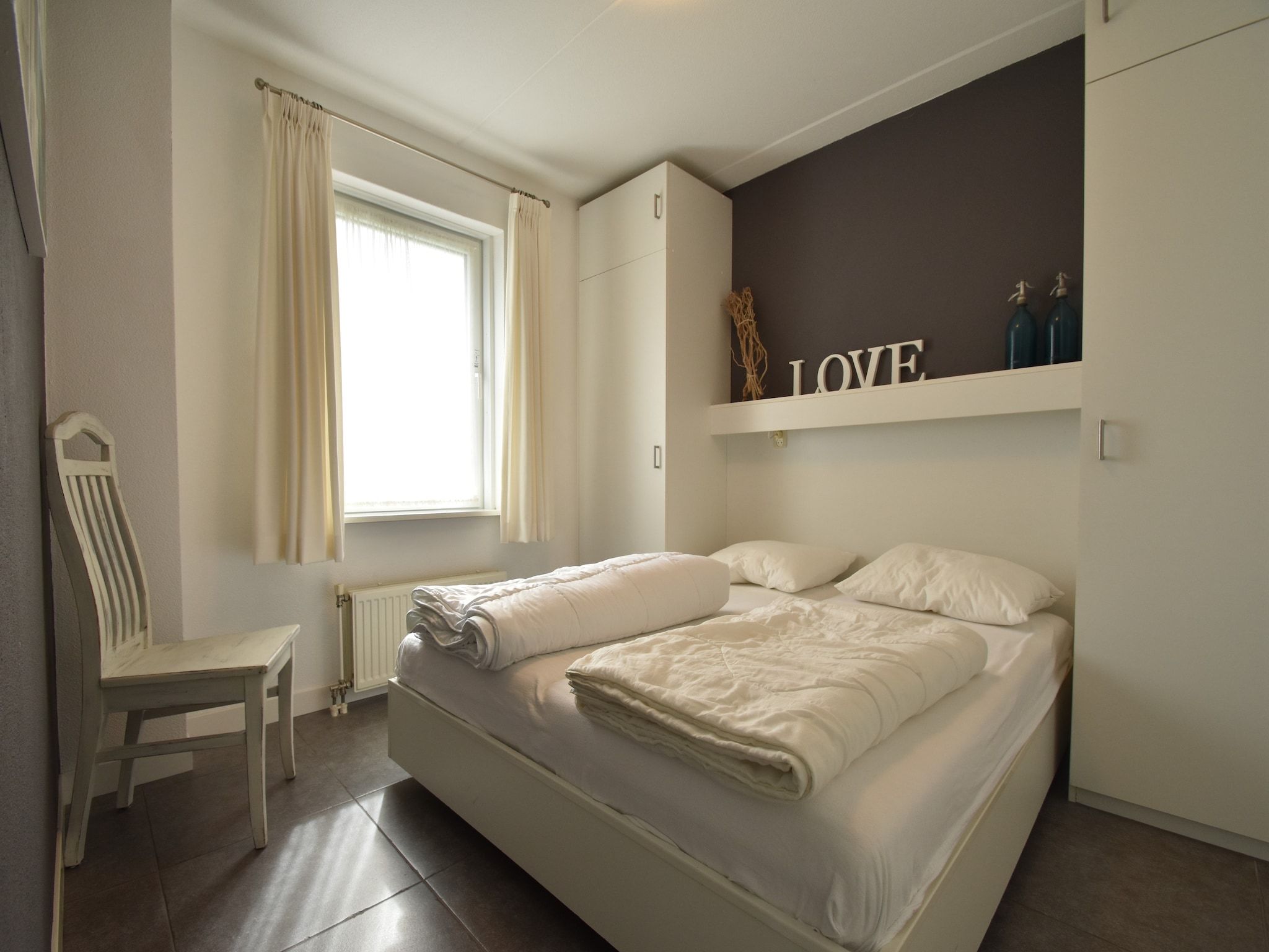 Een slaapkamer van Wellness aan het Water in Eernewolde in Earnewald