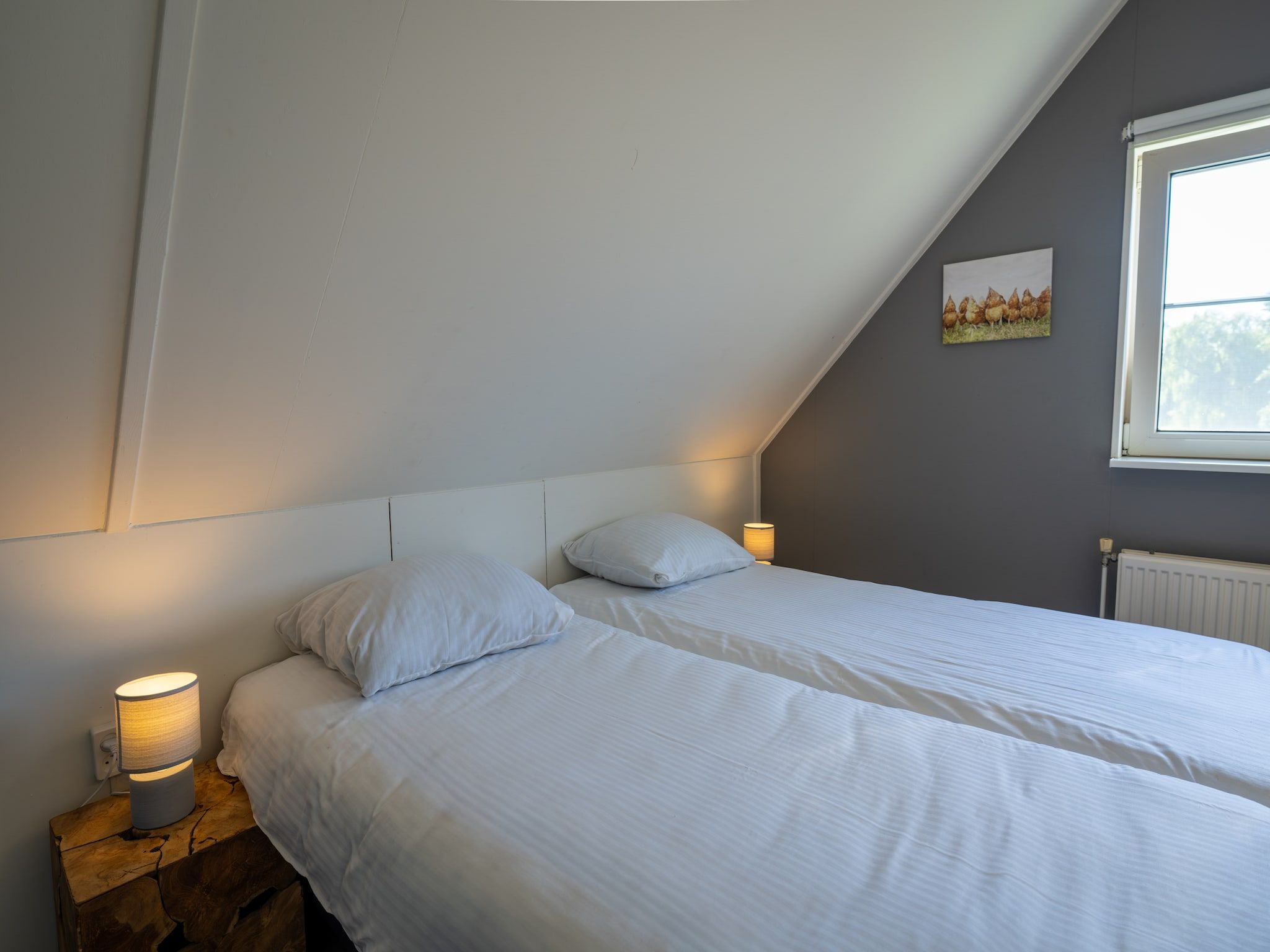 Een slaapkamer van Villapark De Weerribben 5 in Paasloo