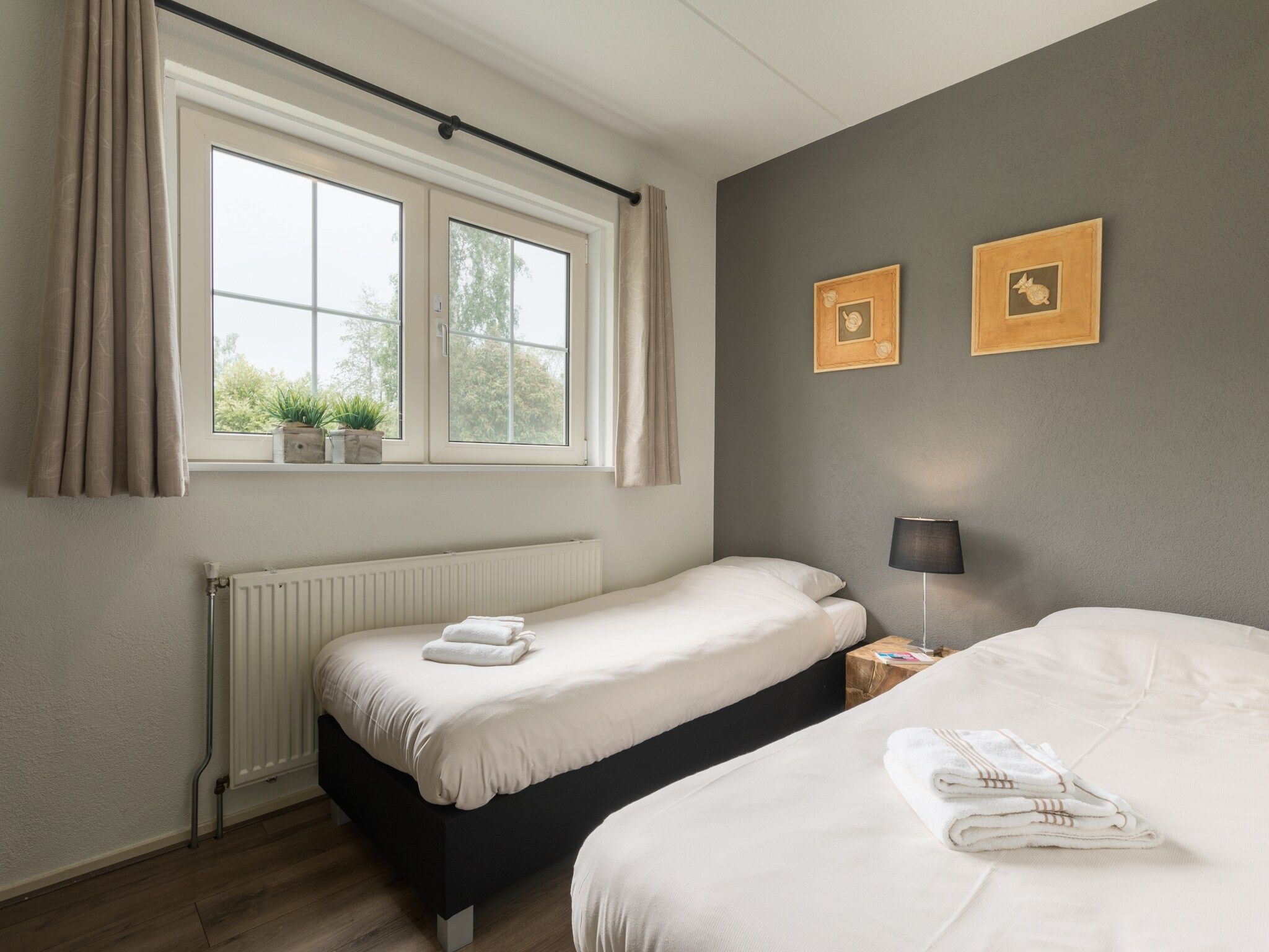 Een slaapkamer van Villapark De Weerribben 3 in Paasloo