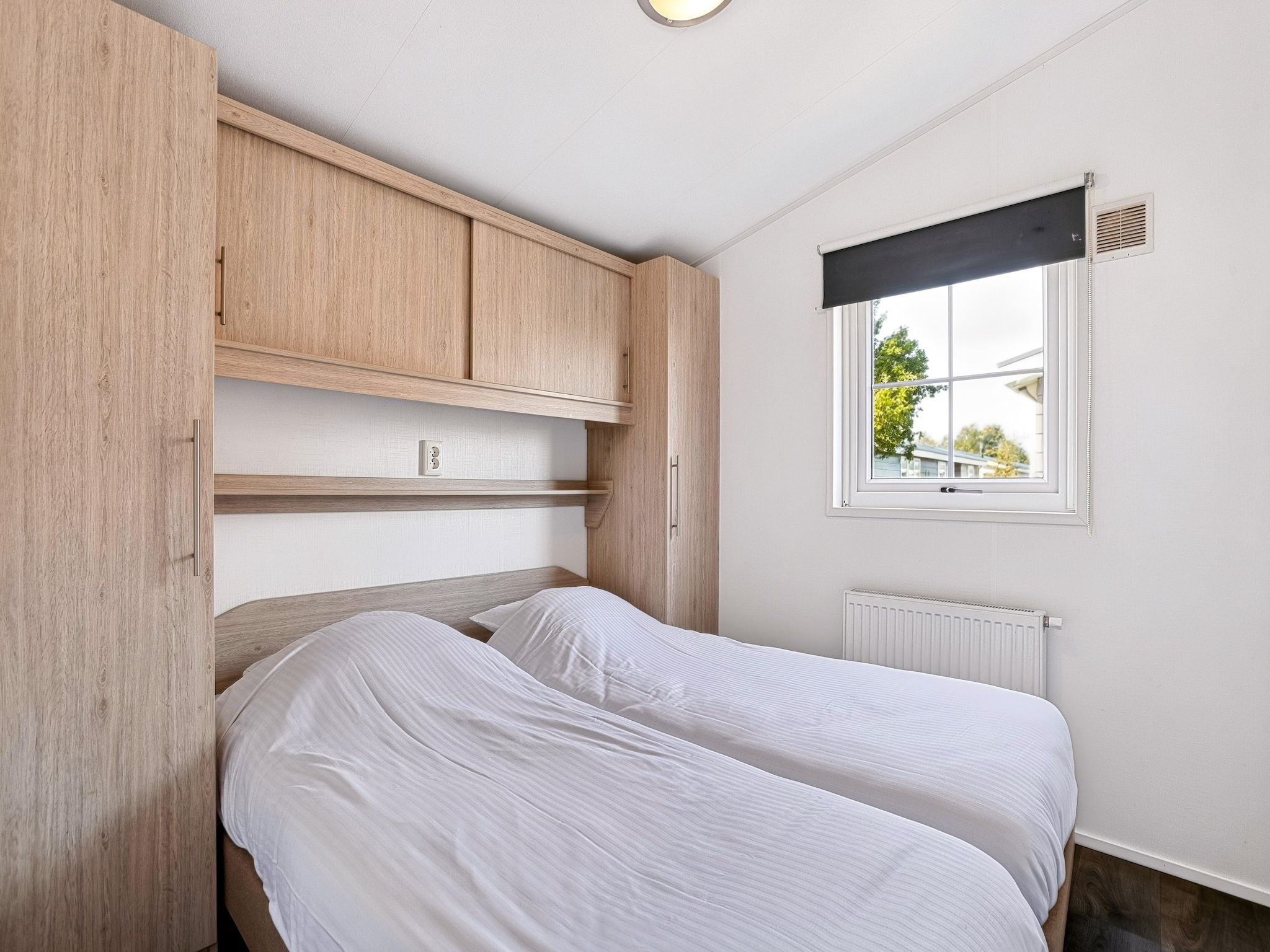 Een slaapkamer van Vakantiepark Giethoorn 4 in Giethoorn