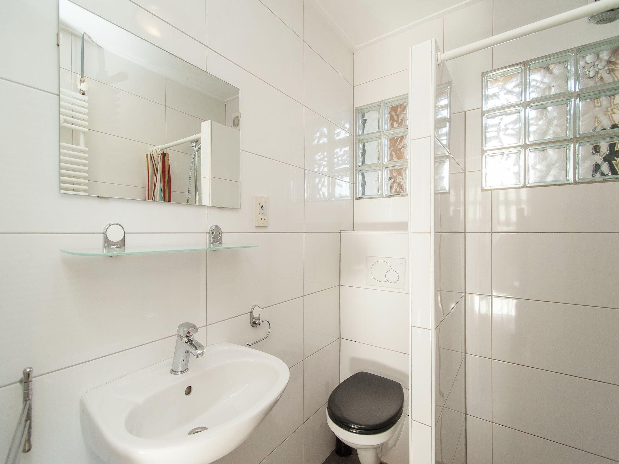 De badkamer van Bungalowpark de Gouden Spar 2 in Noordwijk