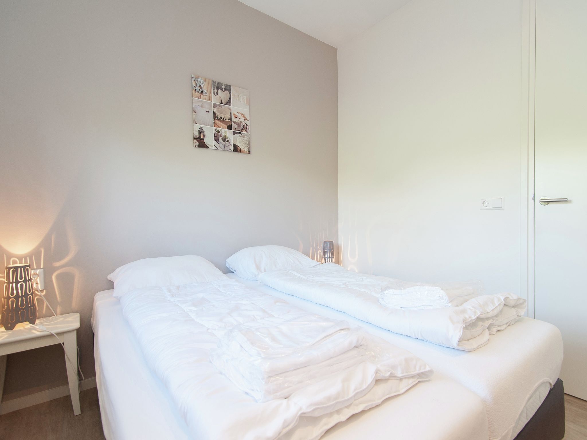 Een slaapkamer van Bungalowpark de Gouden Spar 3 in Noordwijk