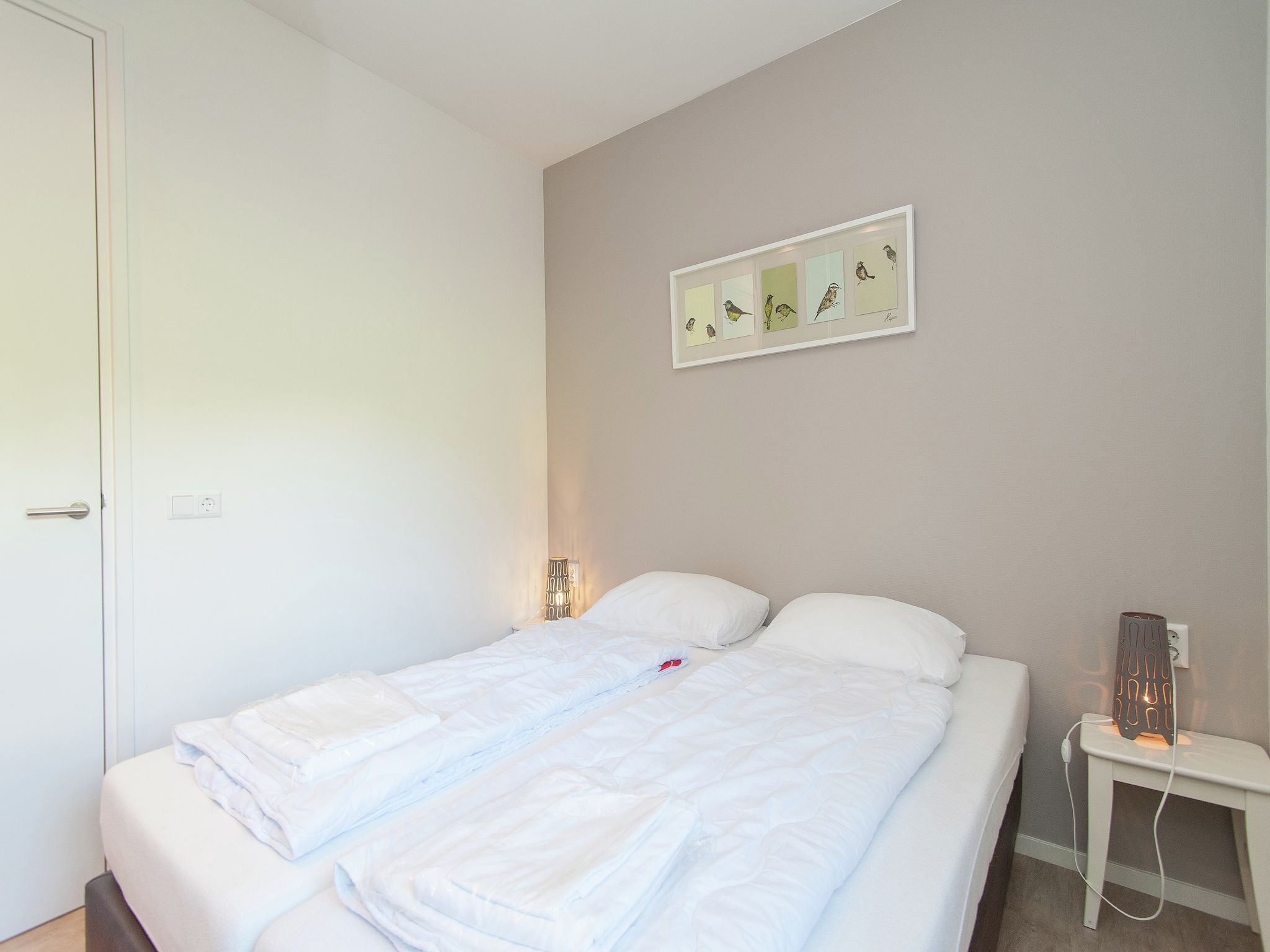 Een slaapkamer van Bungalowpark de Gouden Spar 3 in Noordwijk