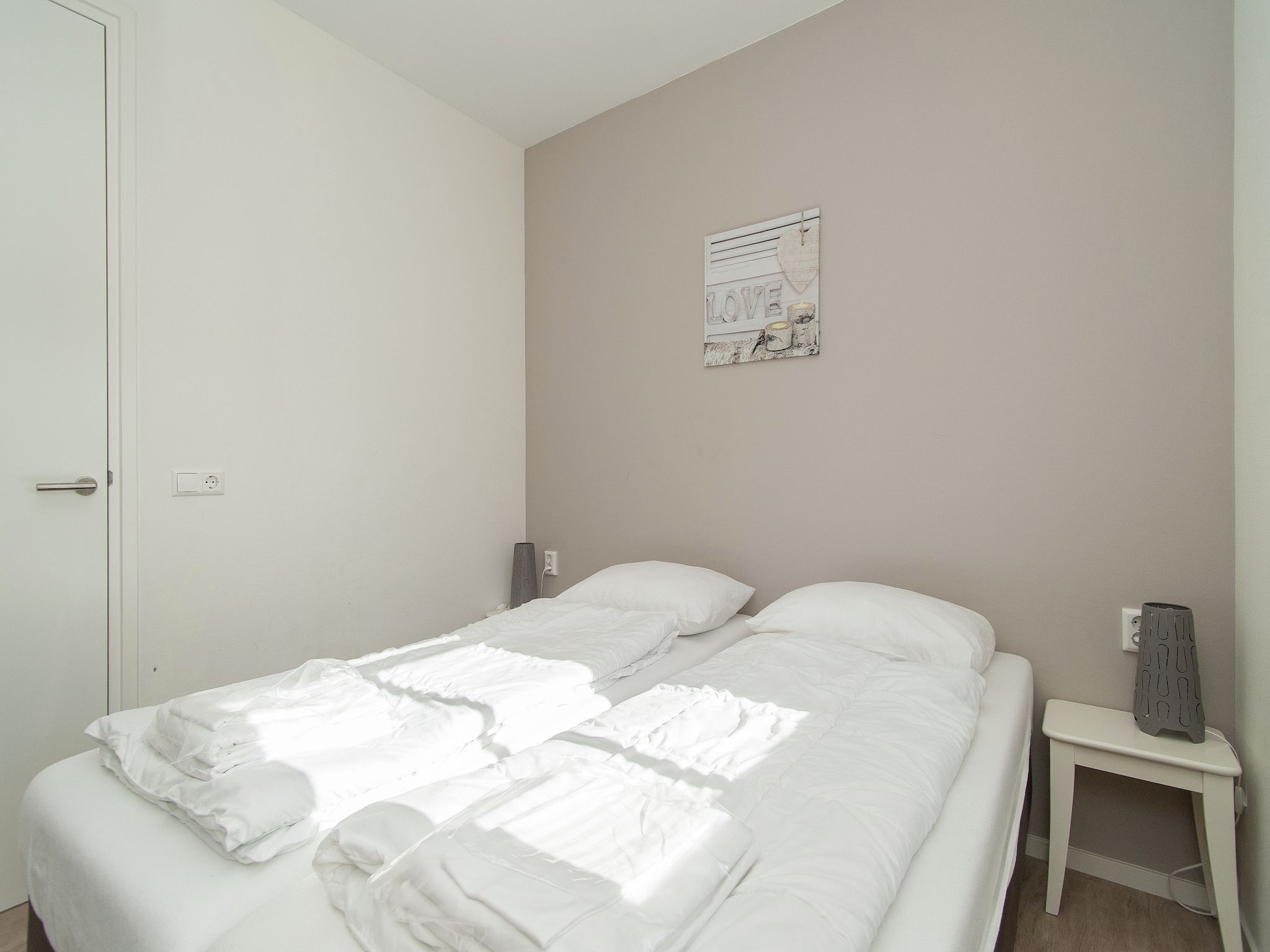 Een slaapkamer van Bungalowpark de Gouden Spar 3 in Noordwijk