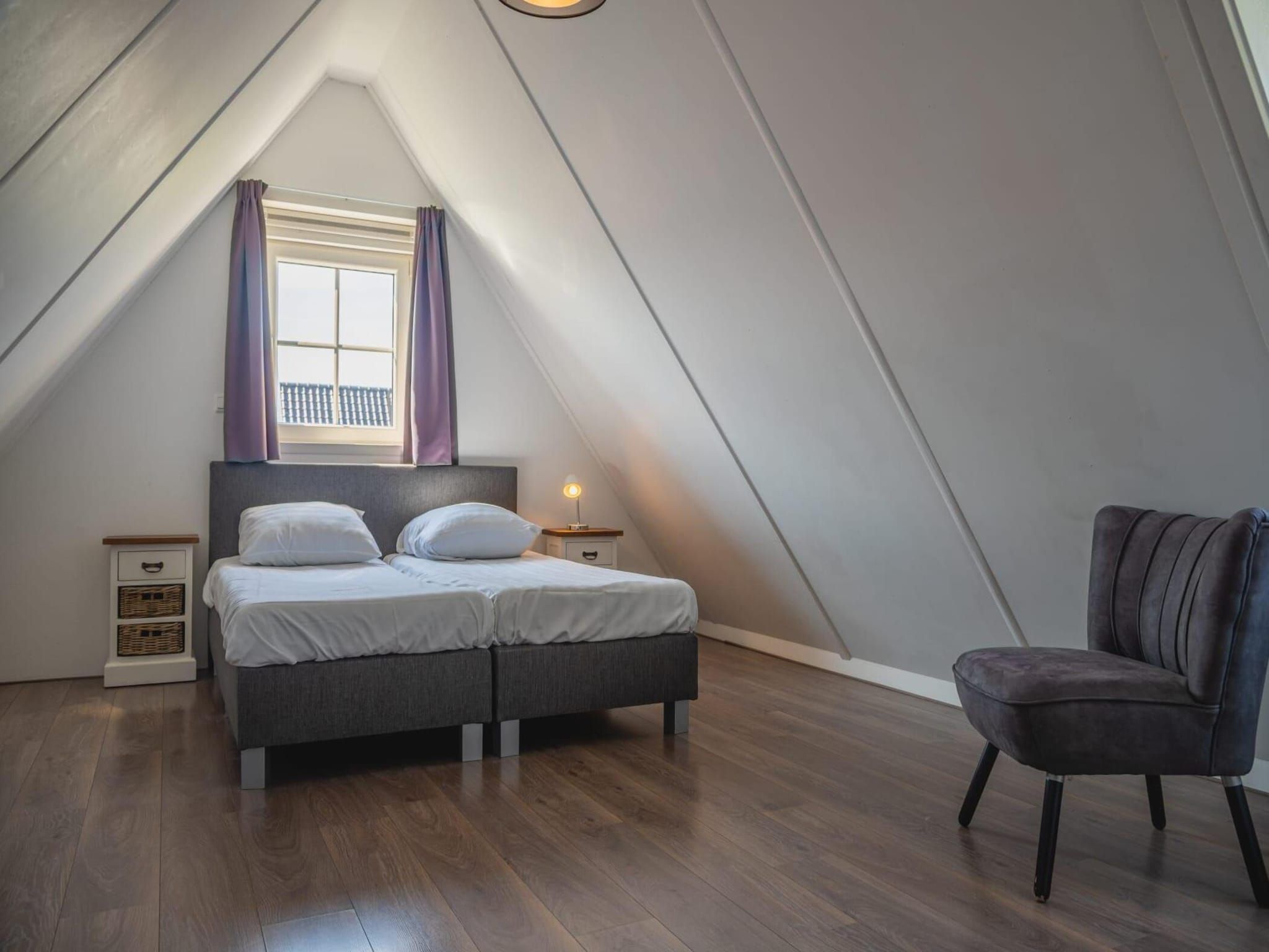 Een slaapkamer van 	Waterland  8 personen in West-Graftdijk