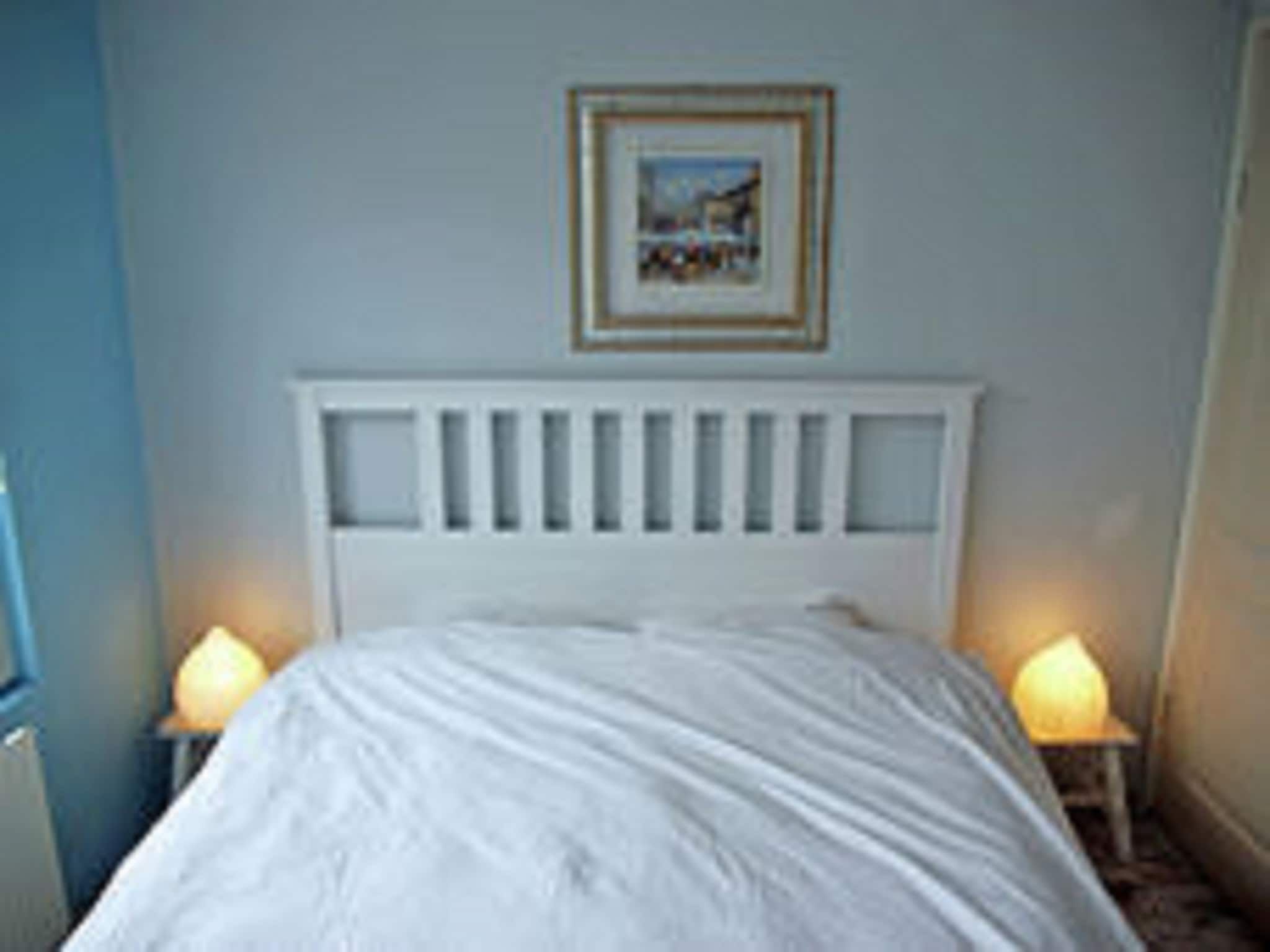 Een slaapkamer van Helmgras II in Egmond aan zee