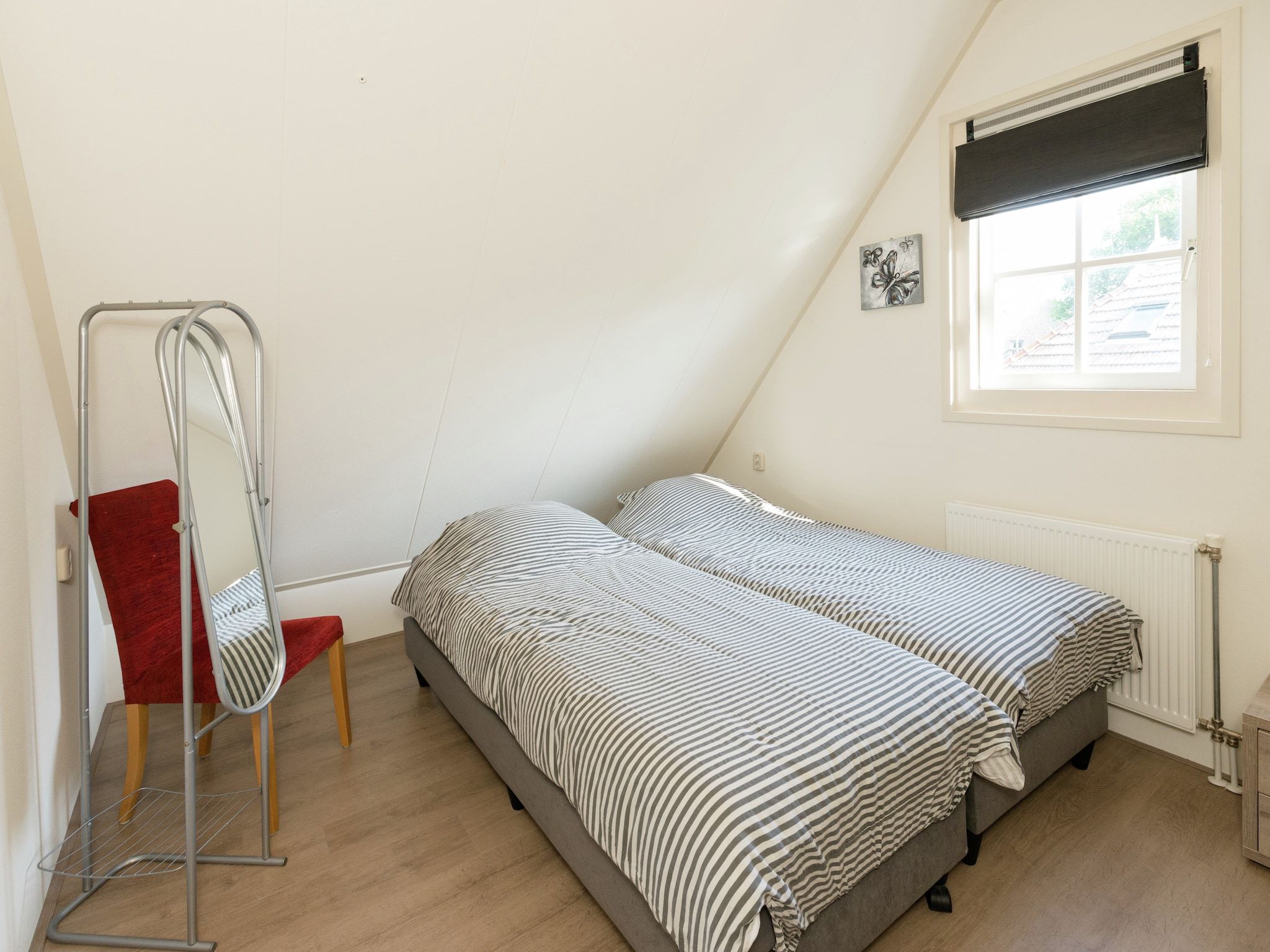 Een slaapkamer van De Grutto in Hippolytushoef