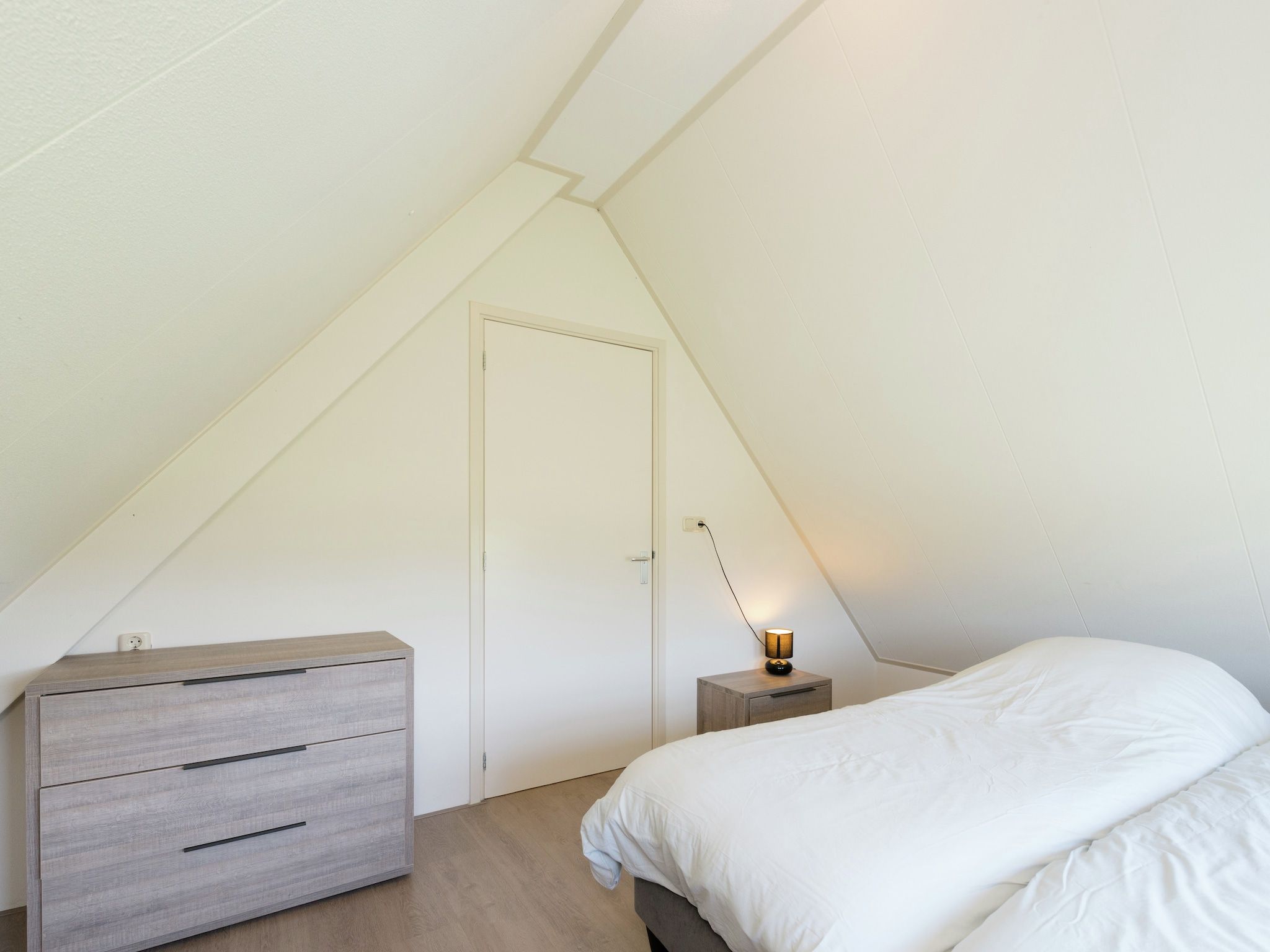 Een slaapkamer van De Grutto in Hippolytushoef