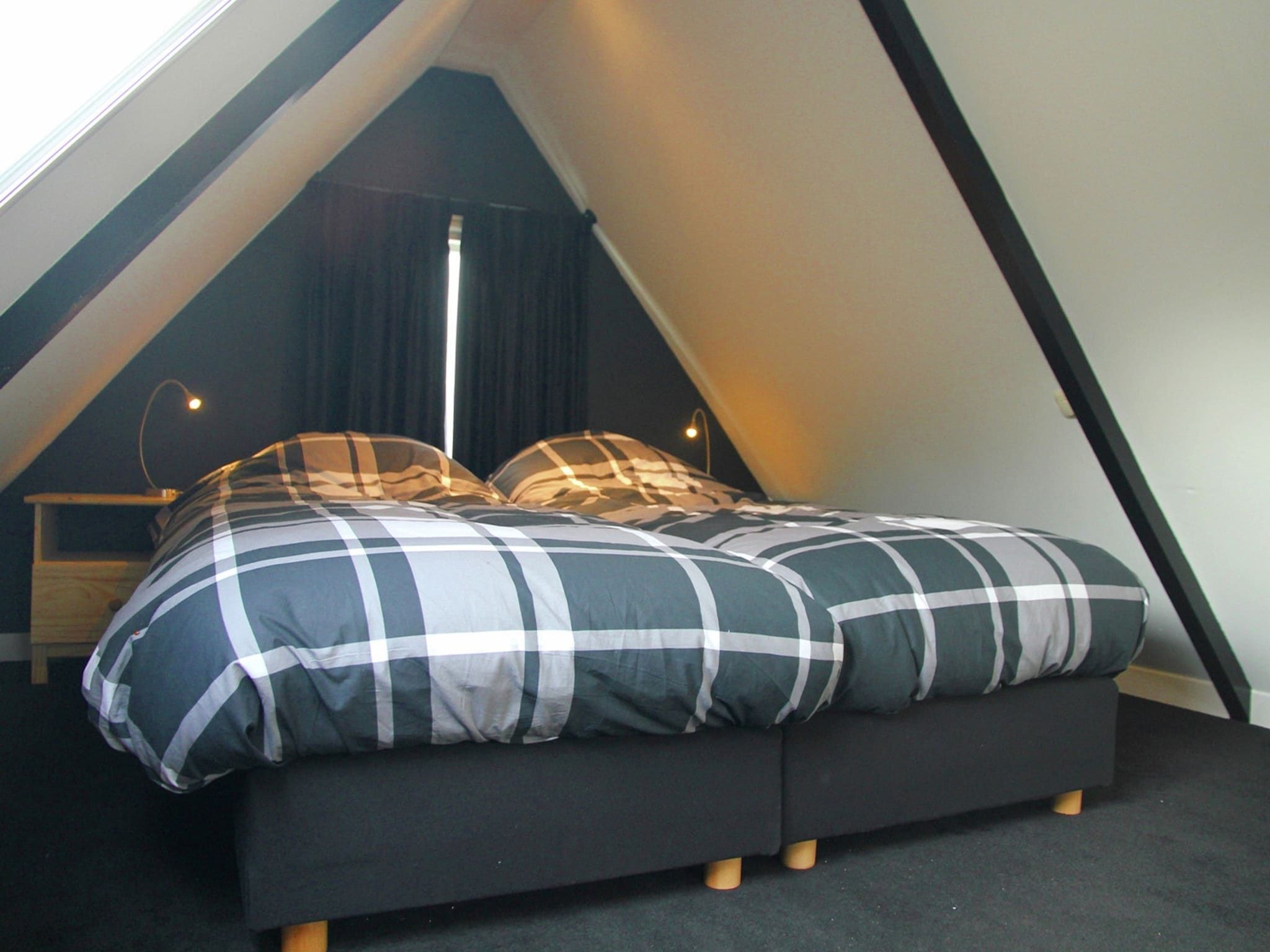 Een slaapkamer van De Ronde O in Heiloo