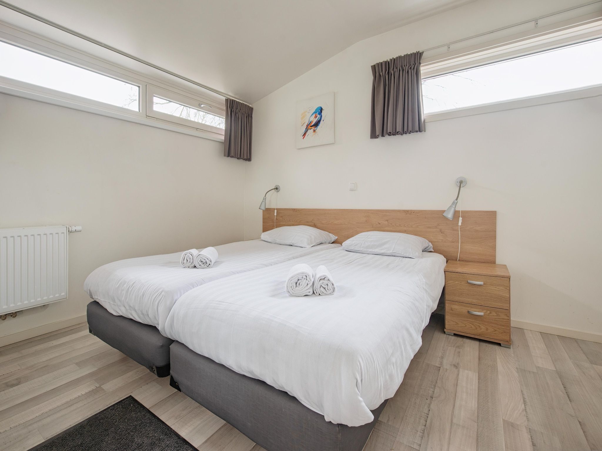 Een slaapkamer van Bungalowpark Schin op Geul 6 in Walem