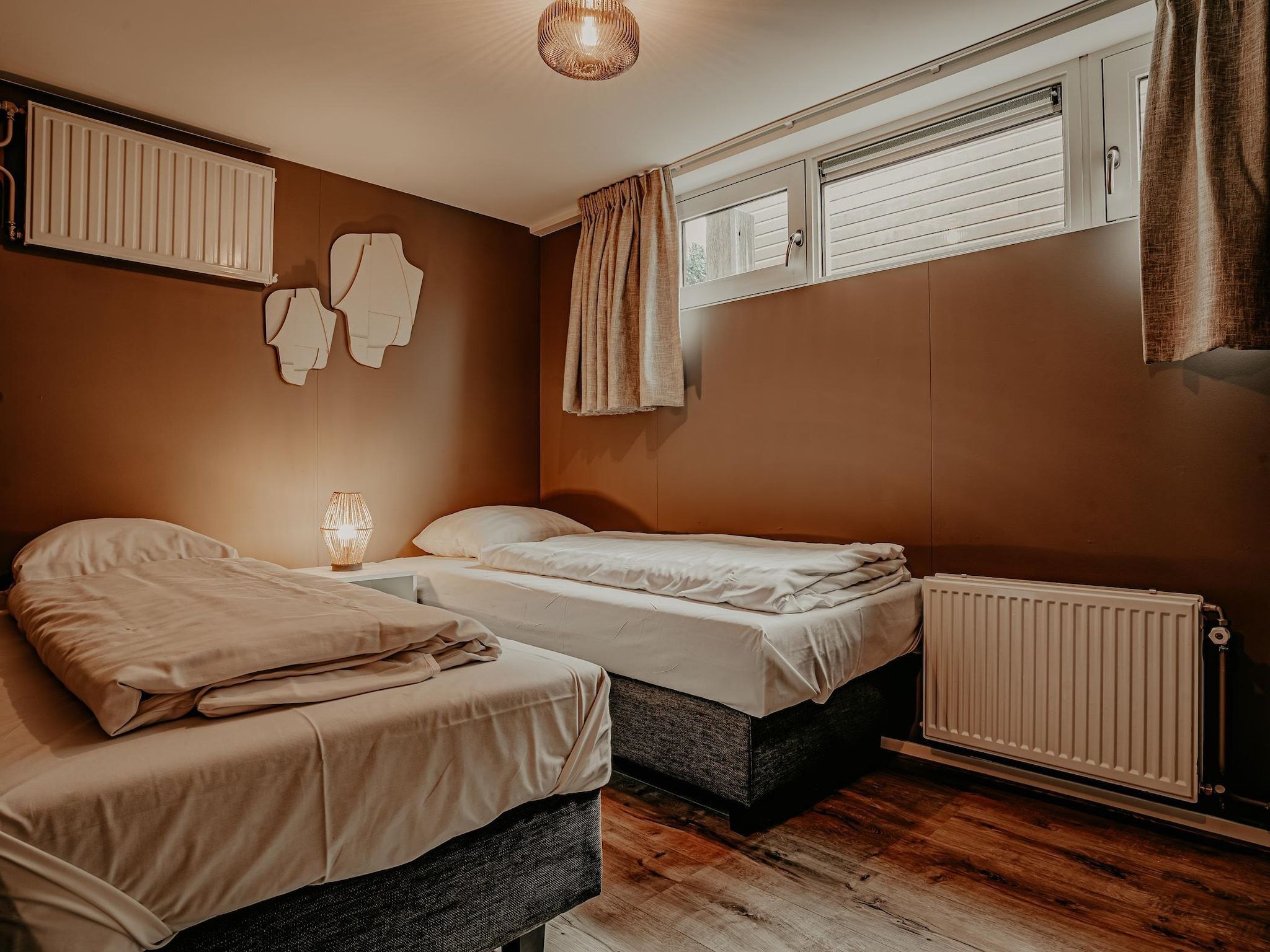 Een slaapkamer van Waterpark de Meerparel 5 in Uitgeest