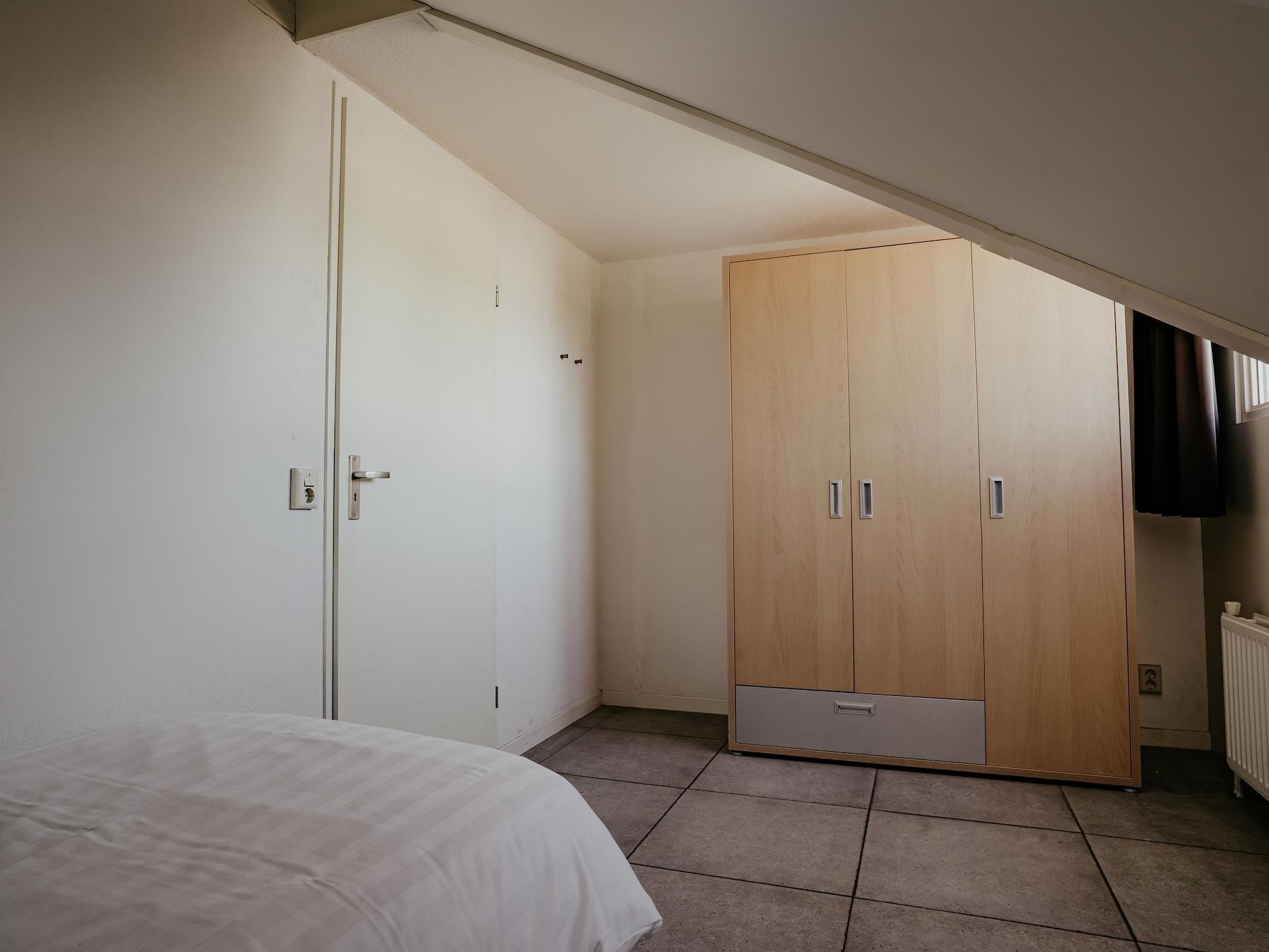 Een slaapkamer van Waterpark de Meerparel 4 in Uitgeest