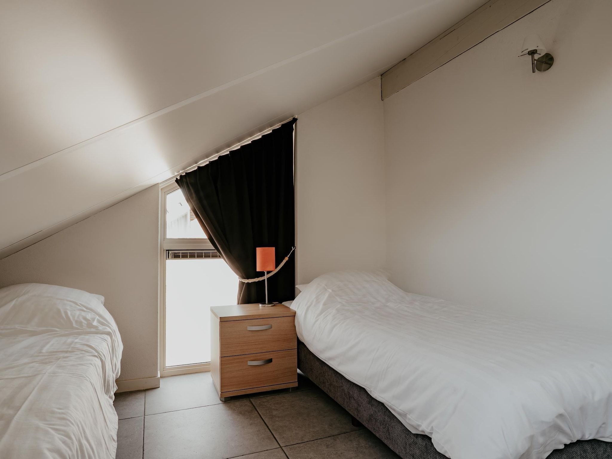 Een slaapkamer van Waterpark de Meerparel 4 in Uitgeest