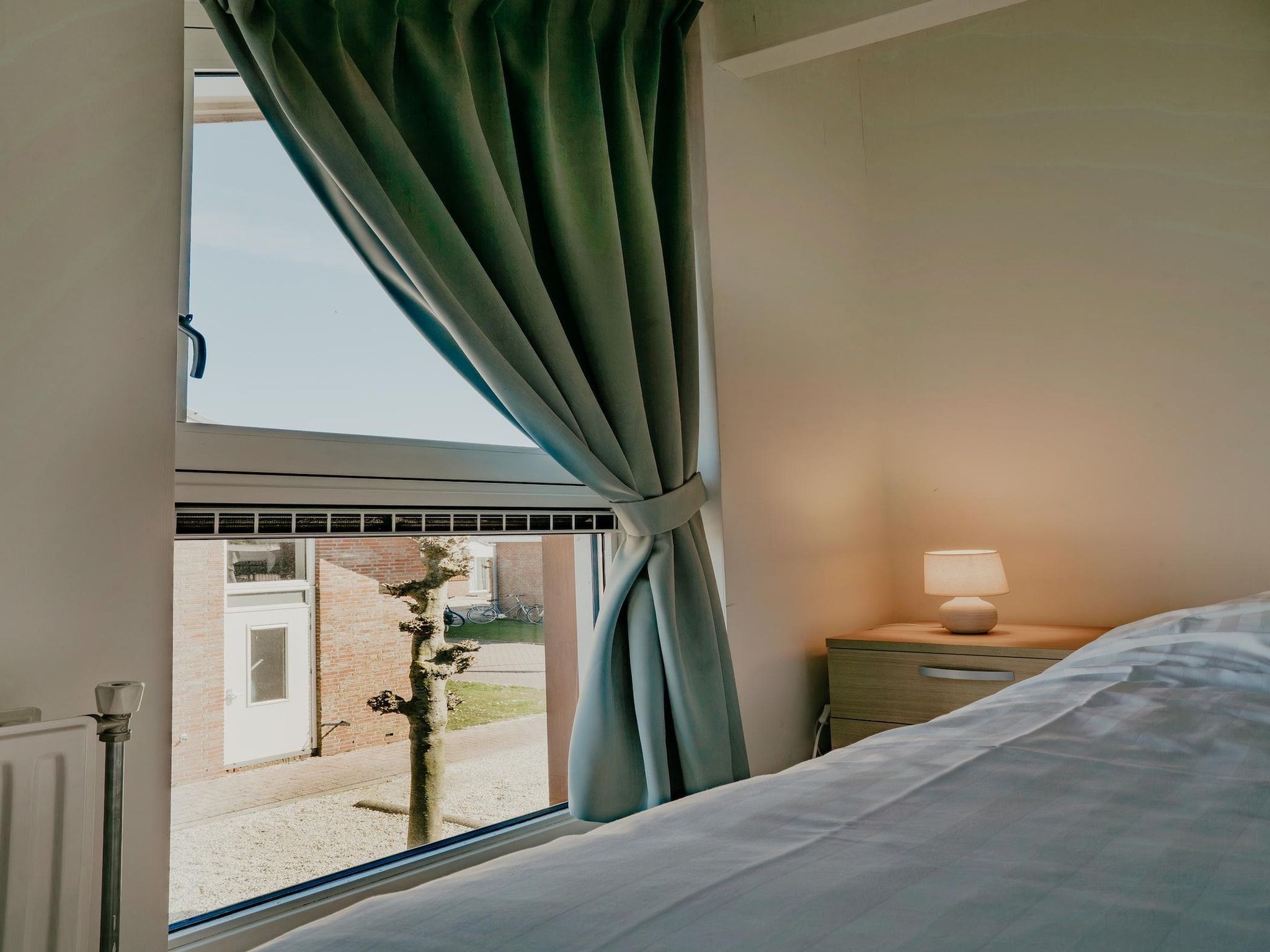 Een slaapkamer van Waterpark de MeerParel 3 in Uitgeest