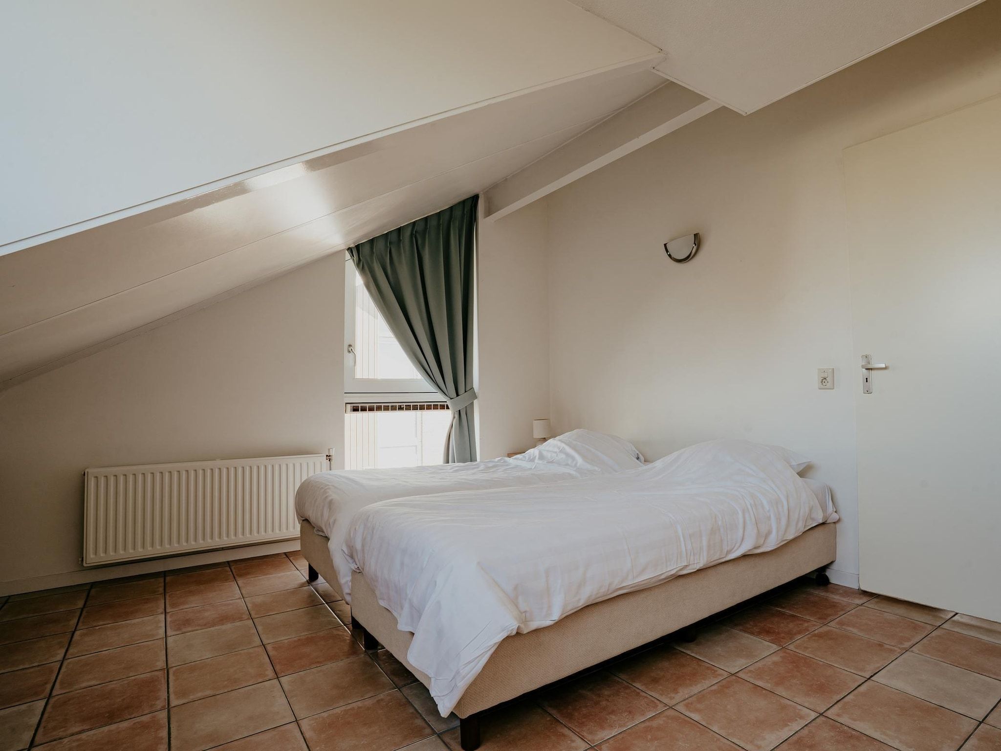 Een slaapkamer van Waterpark de MeerParel 3 in Uitgeest