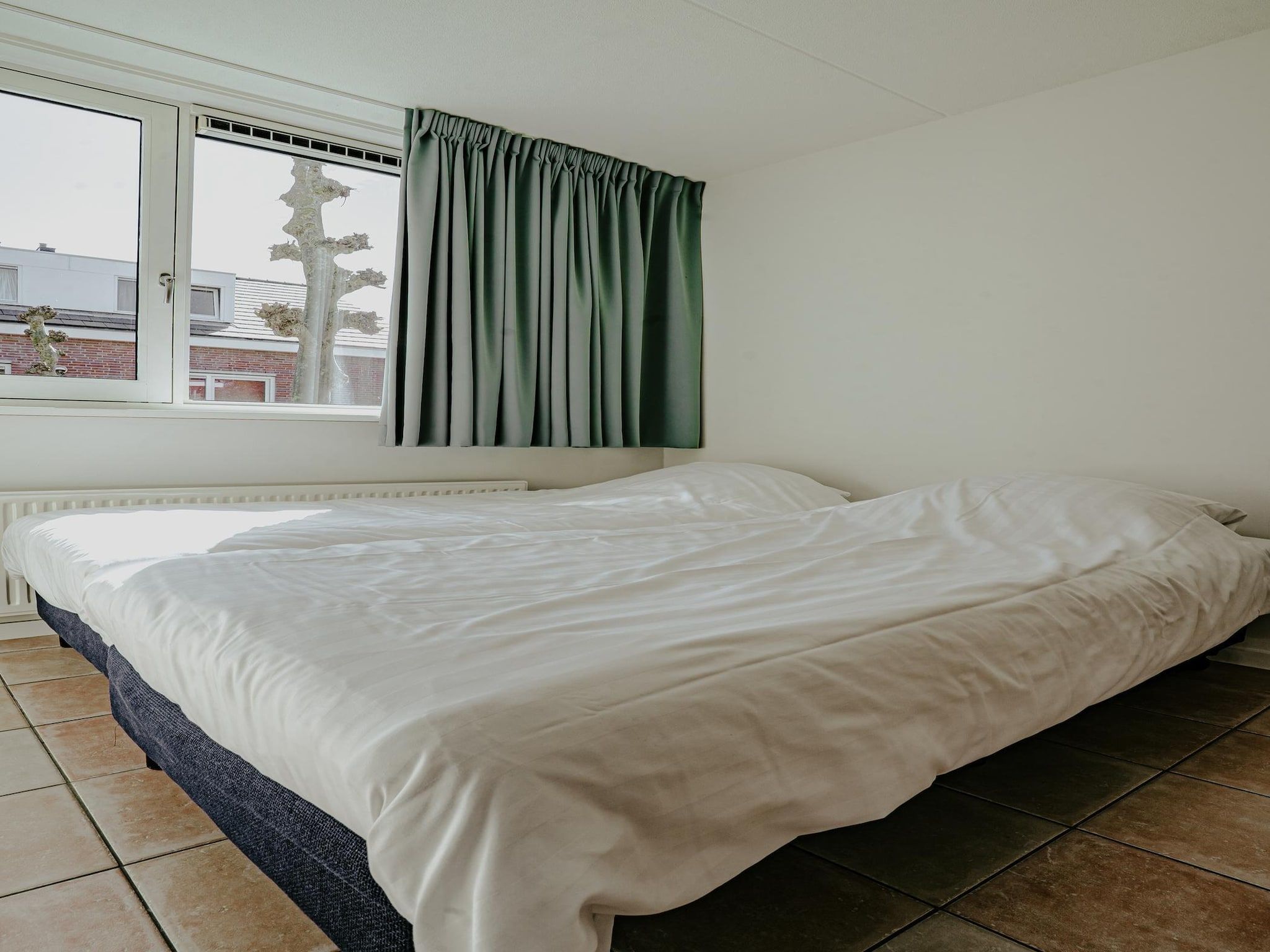 Een slaapkamer van Waterpark de MeerParel 3 in Uitgeest