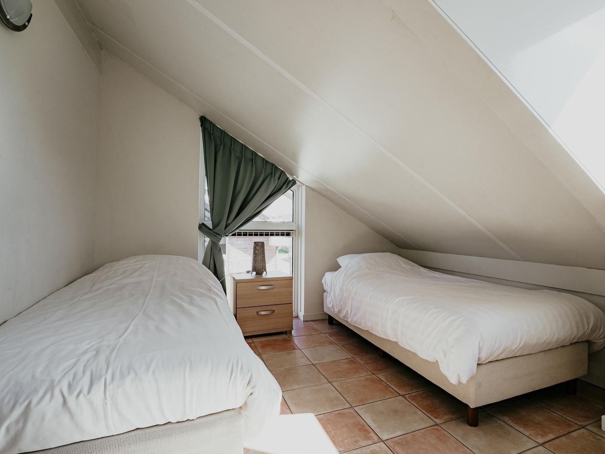 Een slaapkamer van Waterpark de MeerParel 3 in Uitgeest