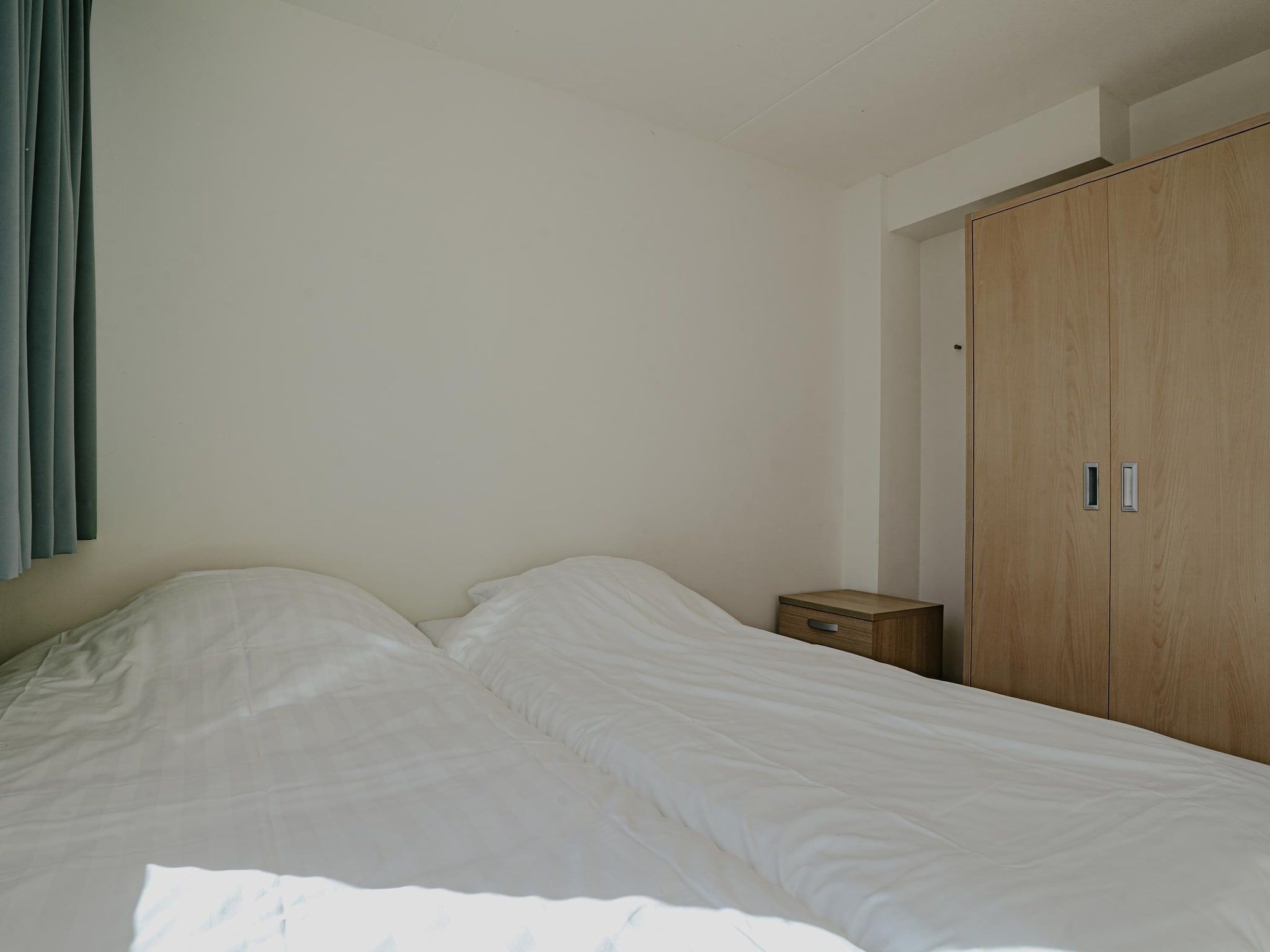 Een slaapkamer van Waterpark de MeerParel 3 in Uitgeest