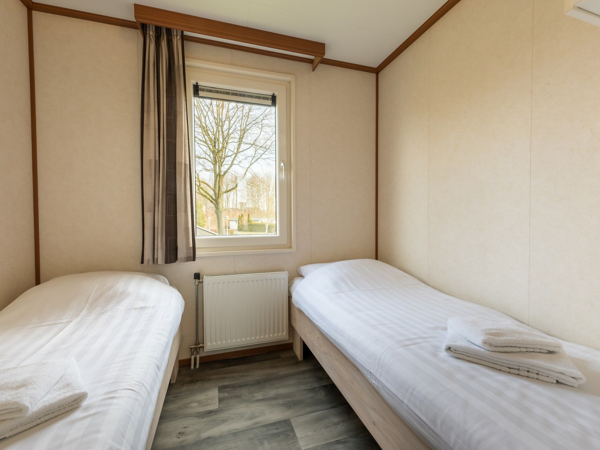 Een slaapkamer van Hunzepark 9 in Gasselternijveen