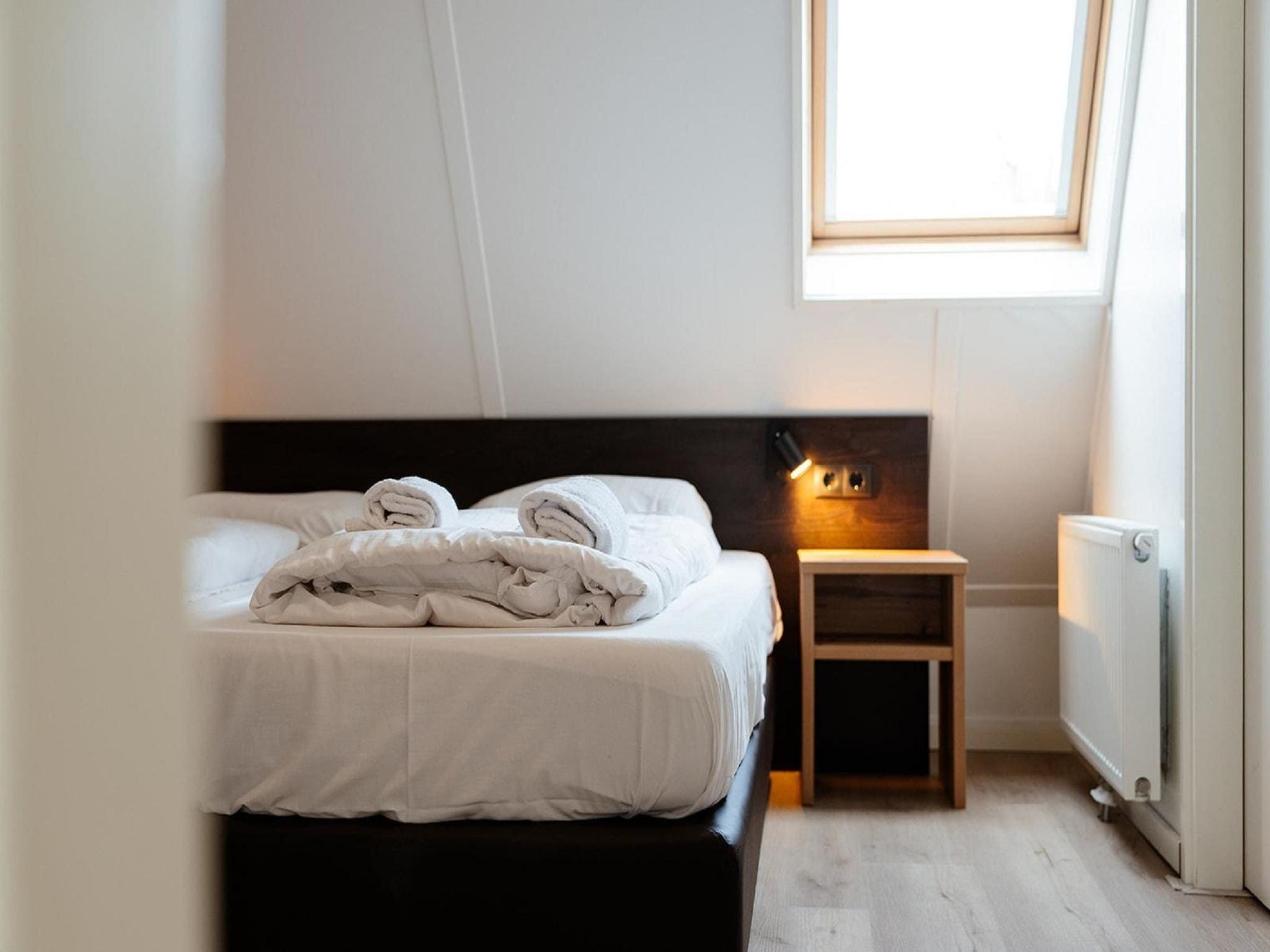 Een slaapkamer van Landgoed De IJsvogel 2 in Voorthuizen