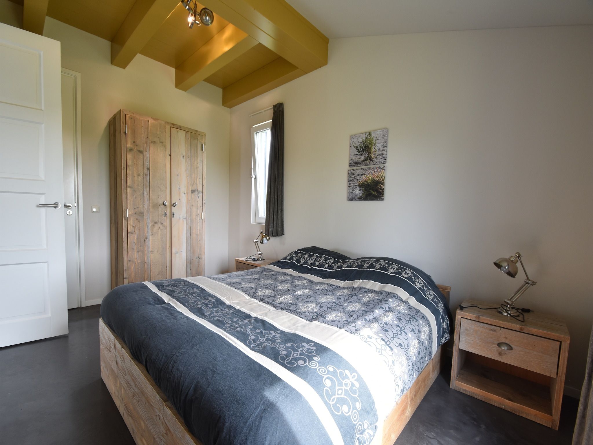 Een slaapkamer van Zeedijk I in Tzummarum