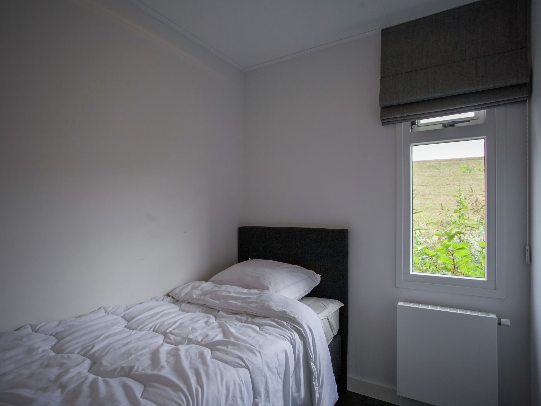 Een slaapkamer van Aan de Oosterschelde in Kattendijke