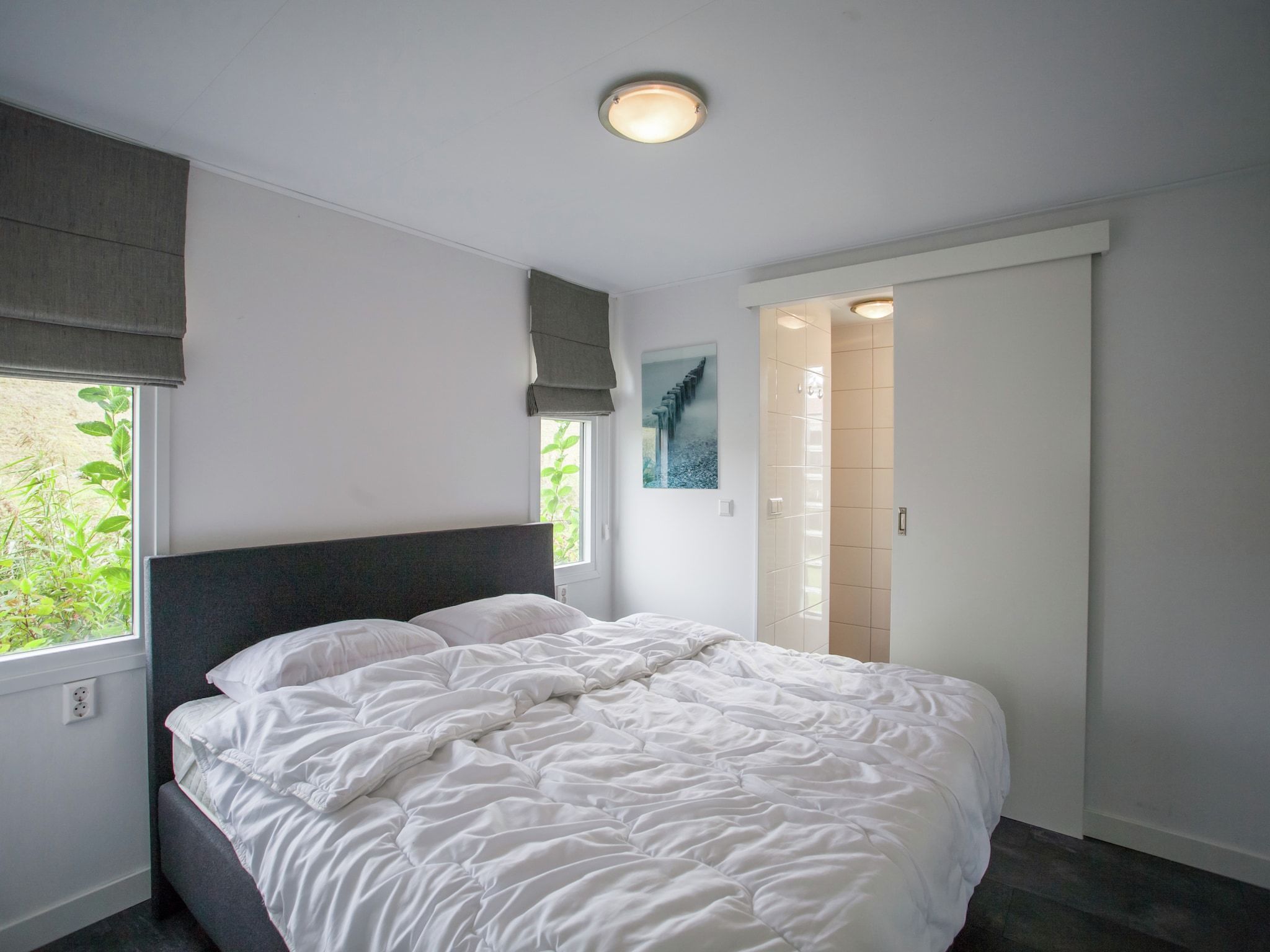 Een slaapkamer van Aan de Oosterschelde in Kattendijke