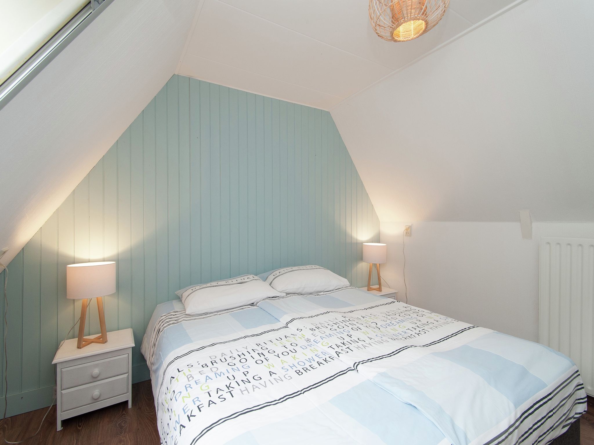 Een slaapkamer van Huize Glory Amethist aan Zee in Bergen aan zee