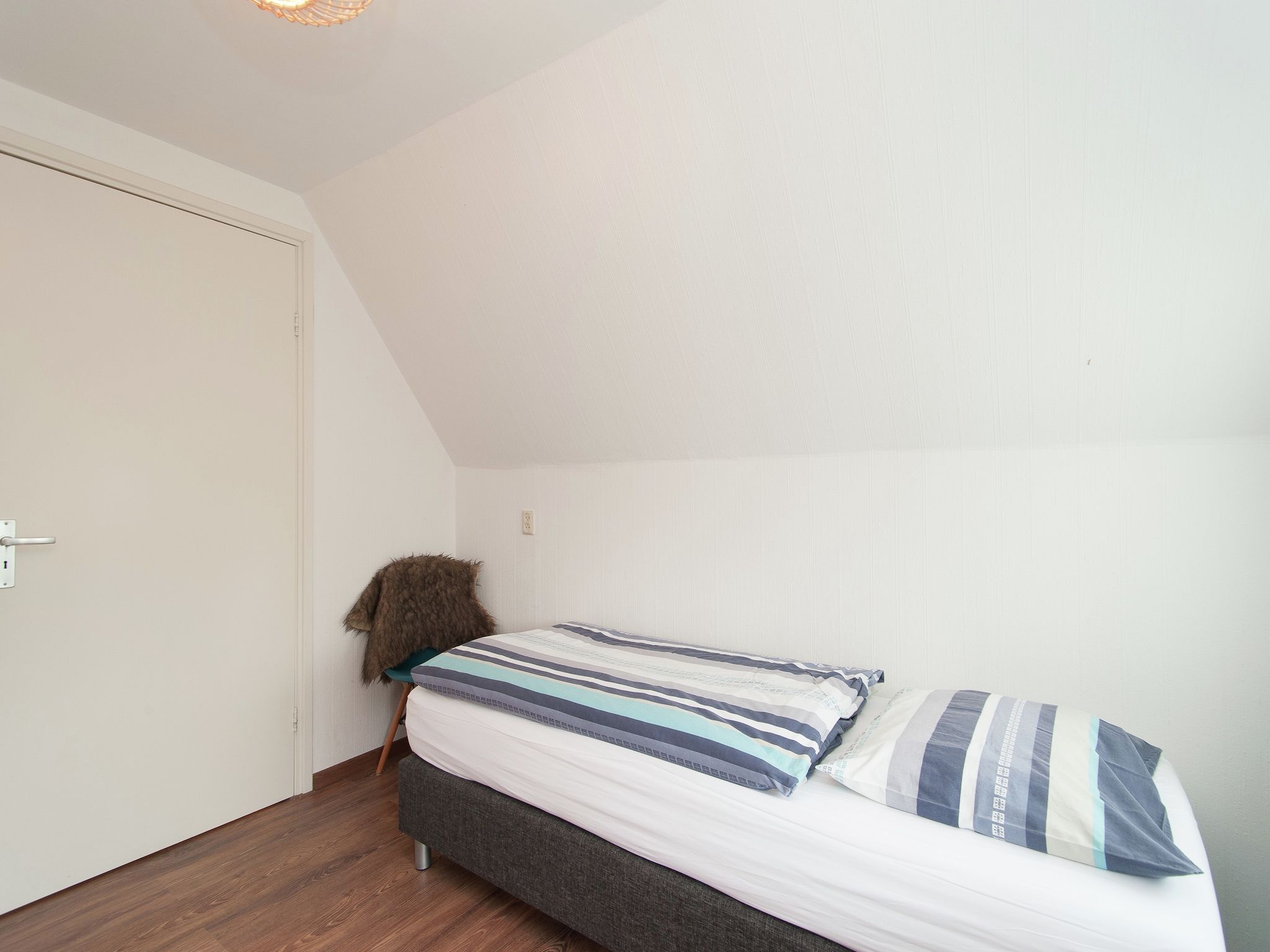 Een slaapkamer van Huize Glory Amethist aan Zee in Bergen aan zee