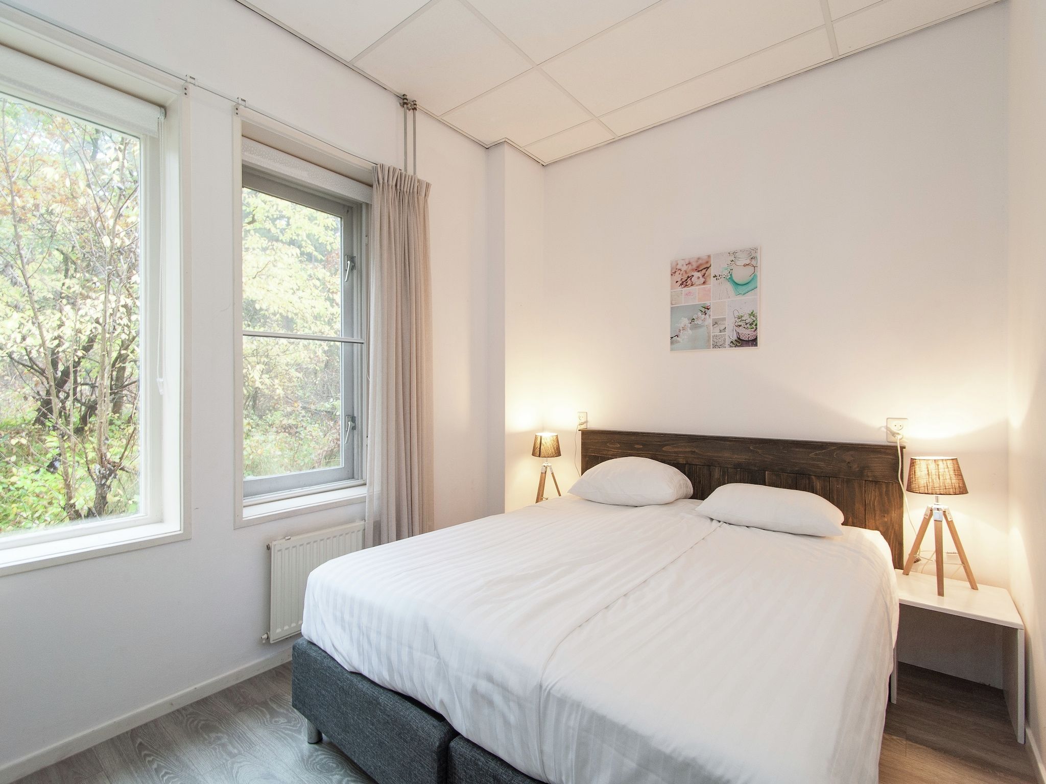 Een slaapkamer van Huize Glory Parel in Bergen aan zee