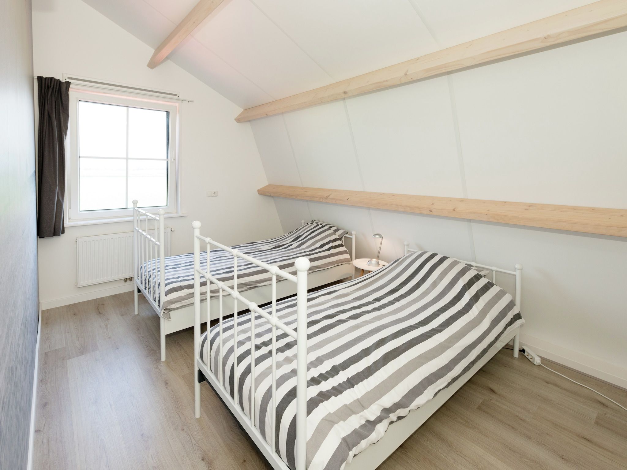 Een slaapkamer van Opvakantiebijdeboer in Schellinkhout