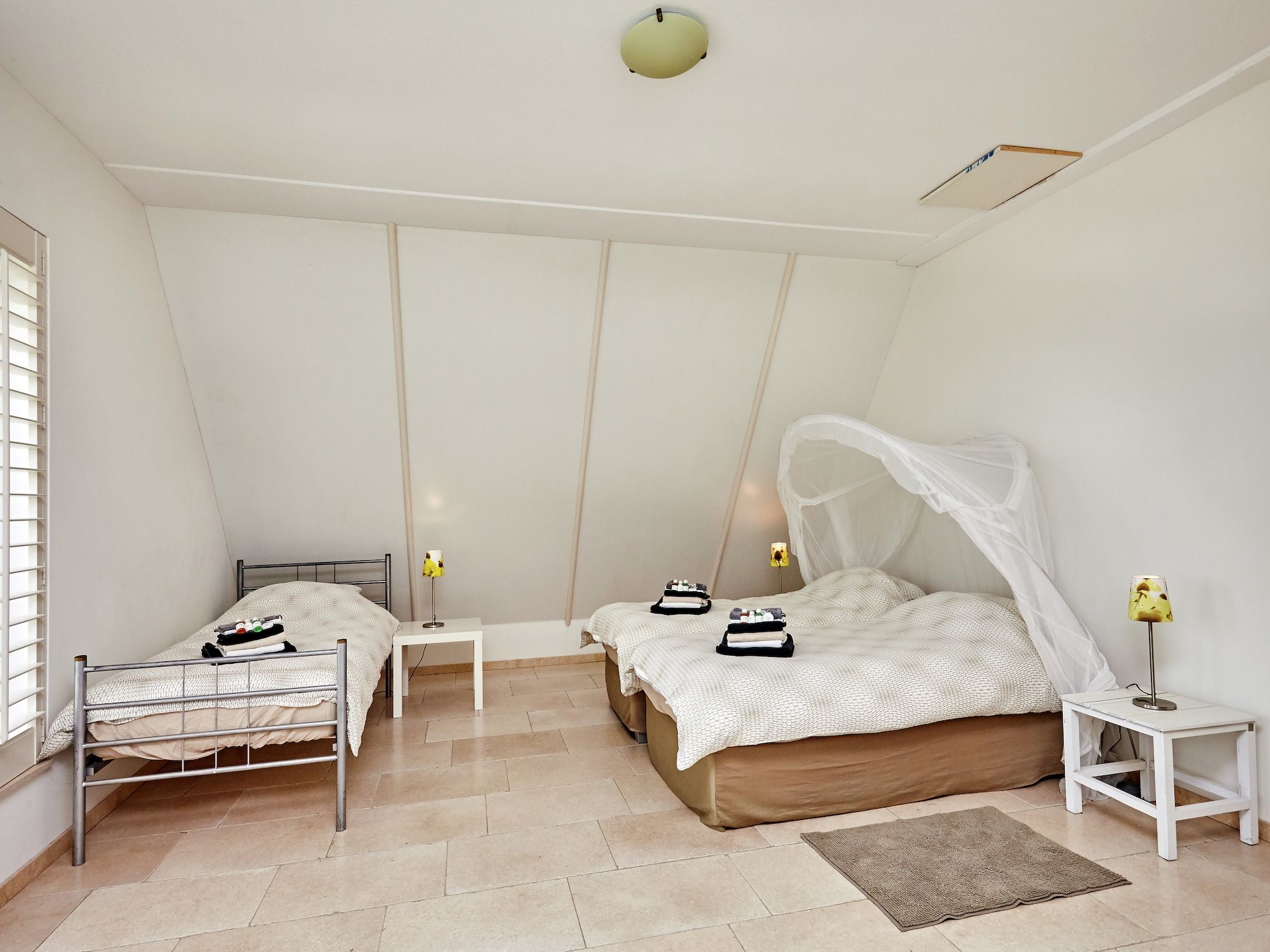 Een slaapkamer van Landhuis Wad Anders in Wierum