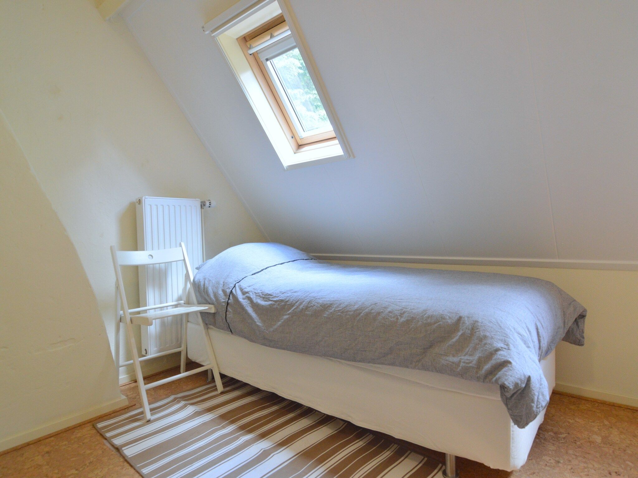 Een slaapkamer van Het Kruisselt in Zelhem