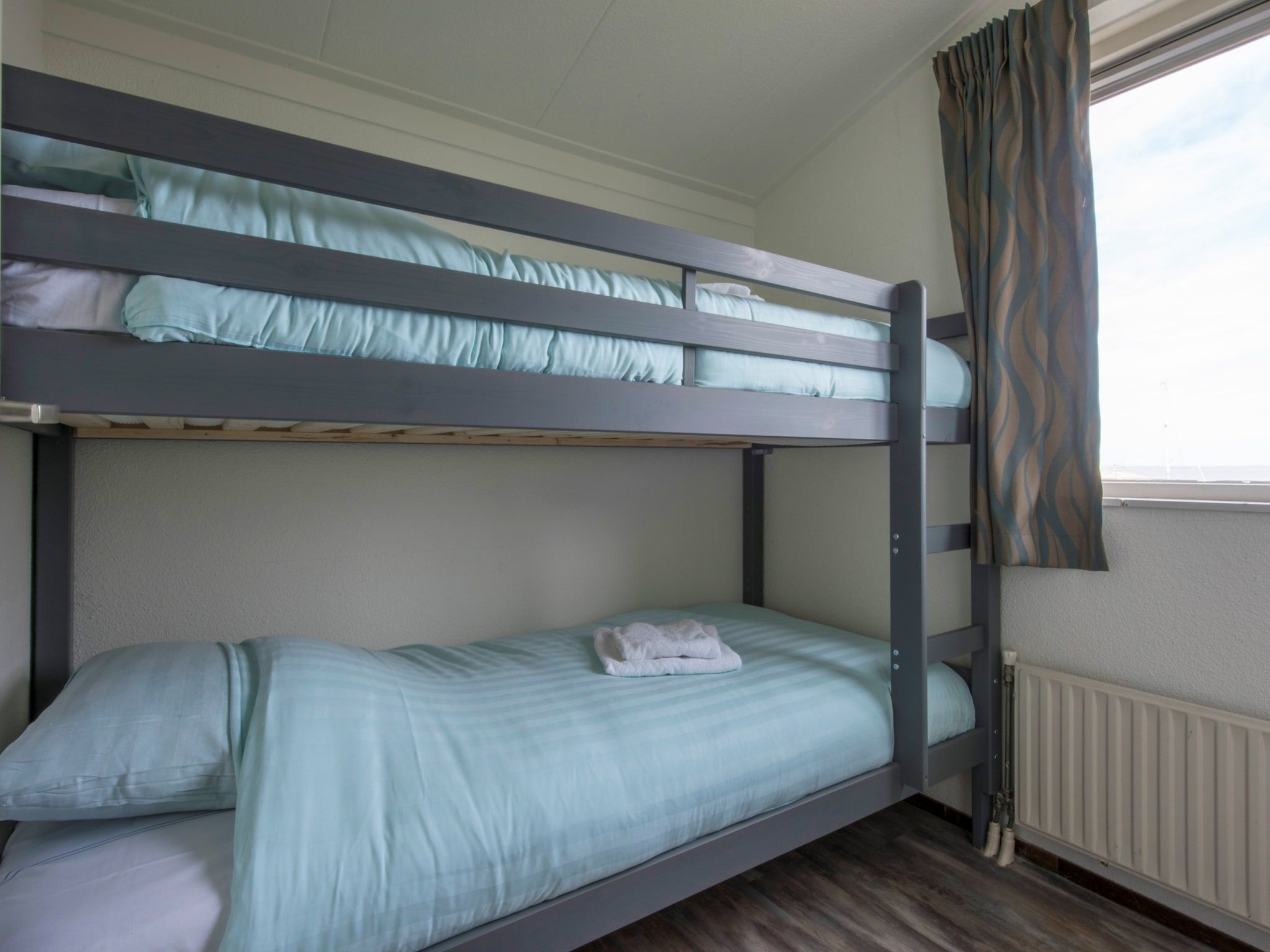 Een slaapkamer van Roompot Beach Resort 5 in Kamperland