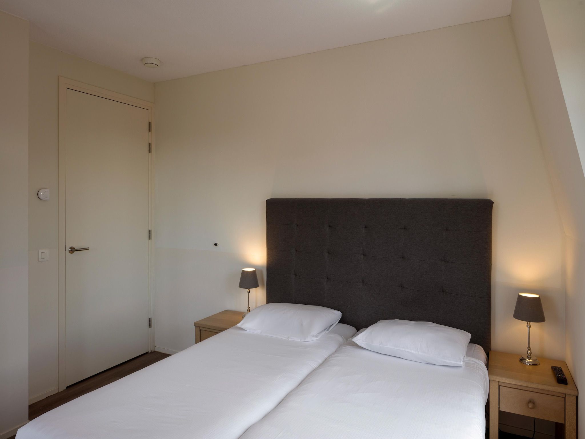 Een slaapkamer van Résidence Wijngaerde 3 in Domburg