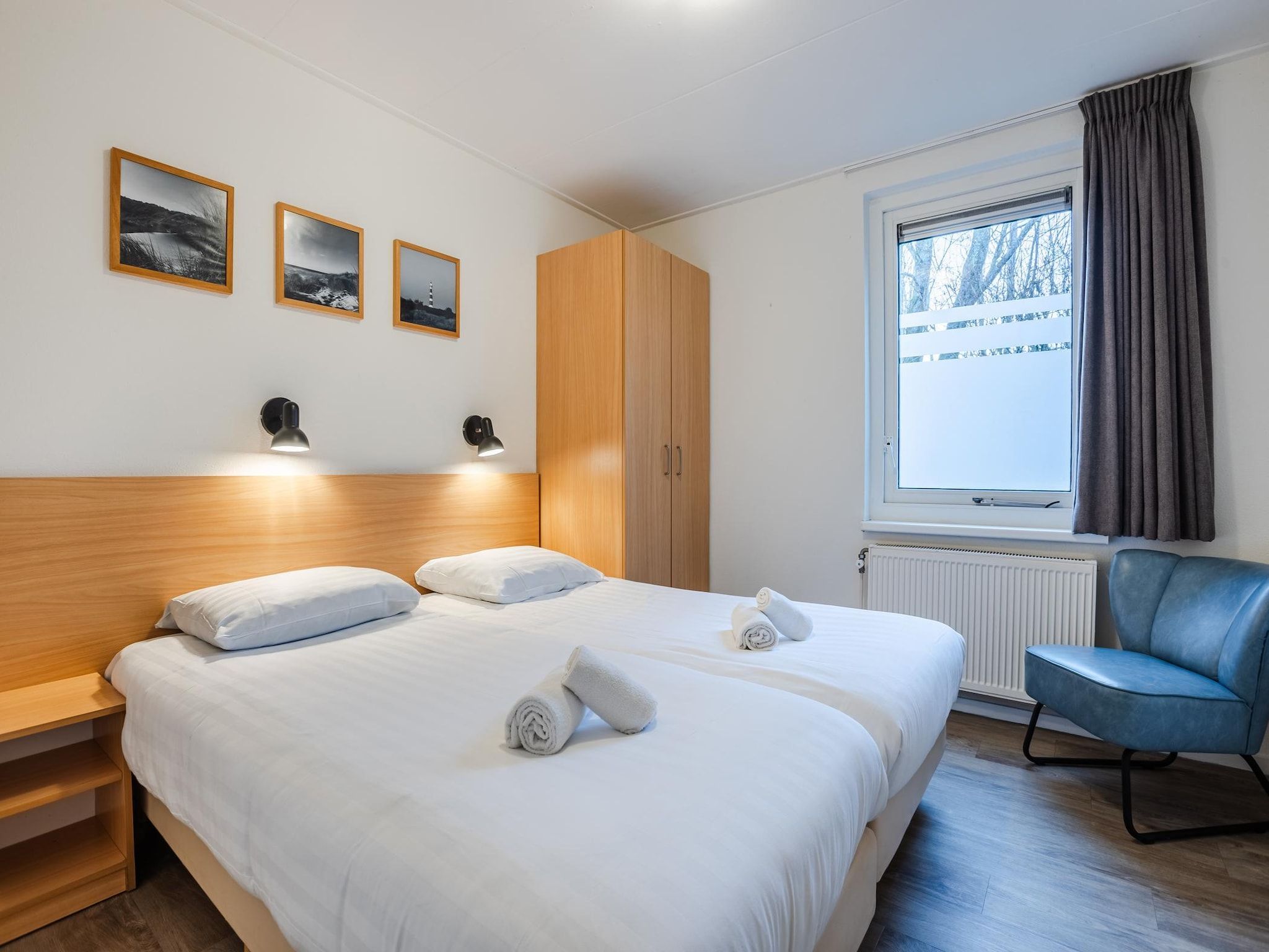 Een slaapkamer van Boomhiemke Duinbungalow 4 in Hollum