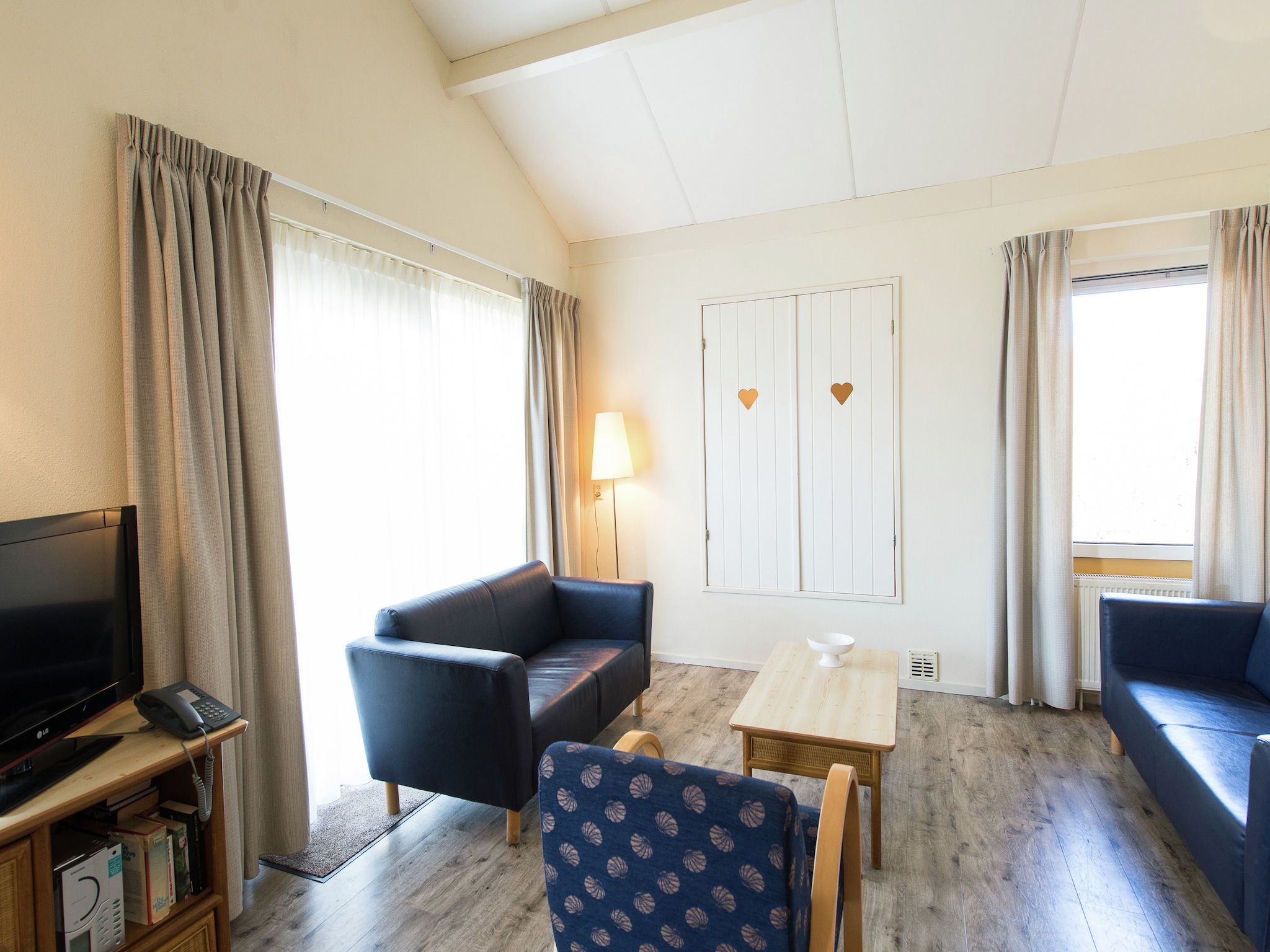 De woonkamer van Vakantiepark Boomhiemke 9 in Hollum