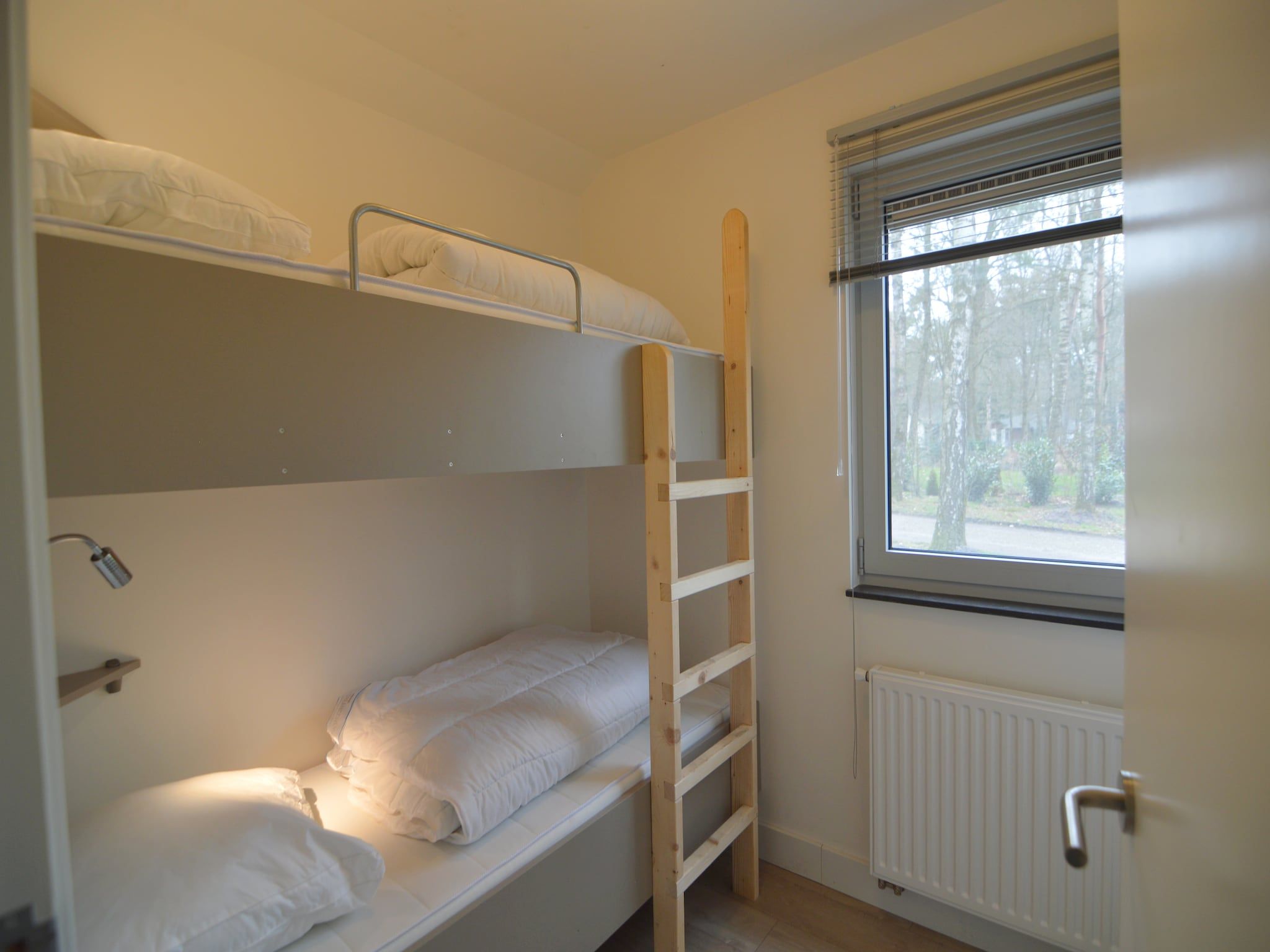 Een slaapkamer van Bungalow 5 in Stramproy