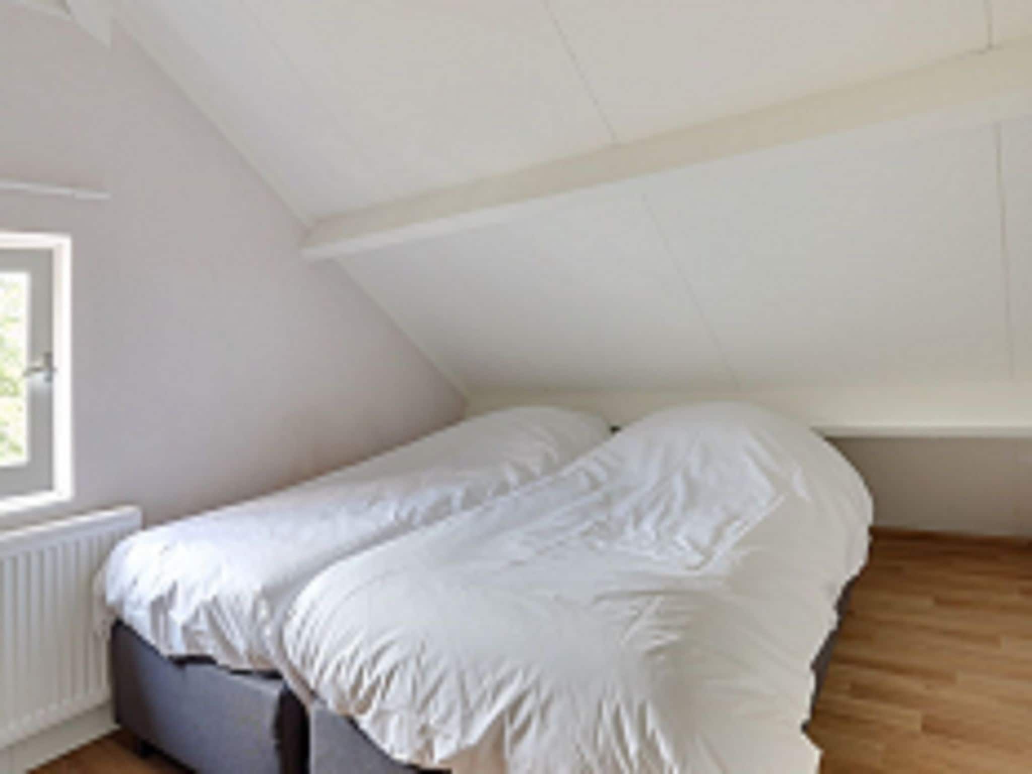 Een slaapkamer van Vakantiepark Sandberghe 1 in Uden