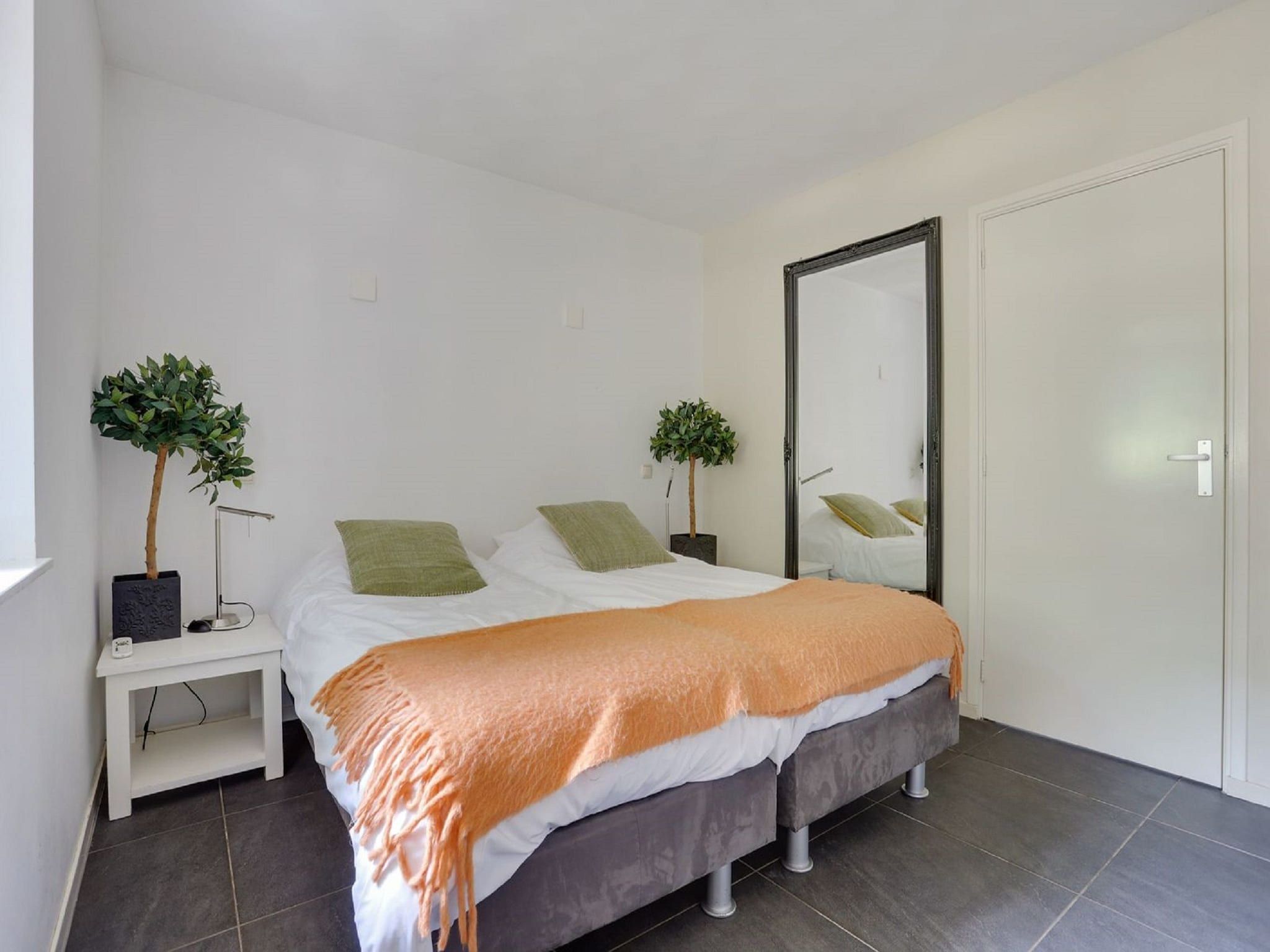 Een slaapkamer van Vakantiepark Sandberghe 2 in Uden