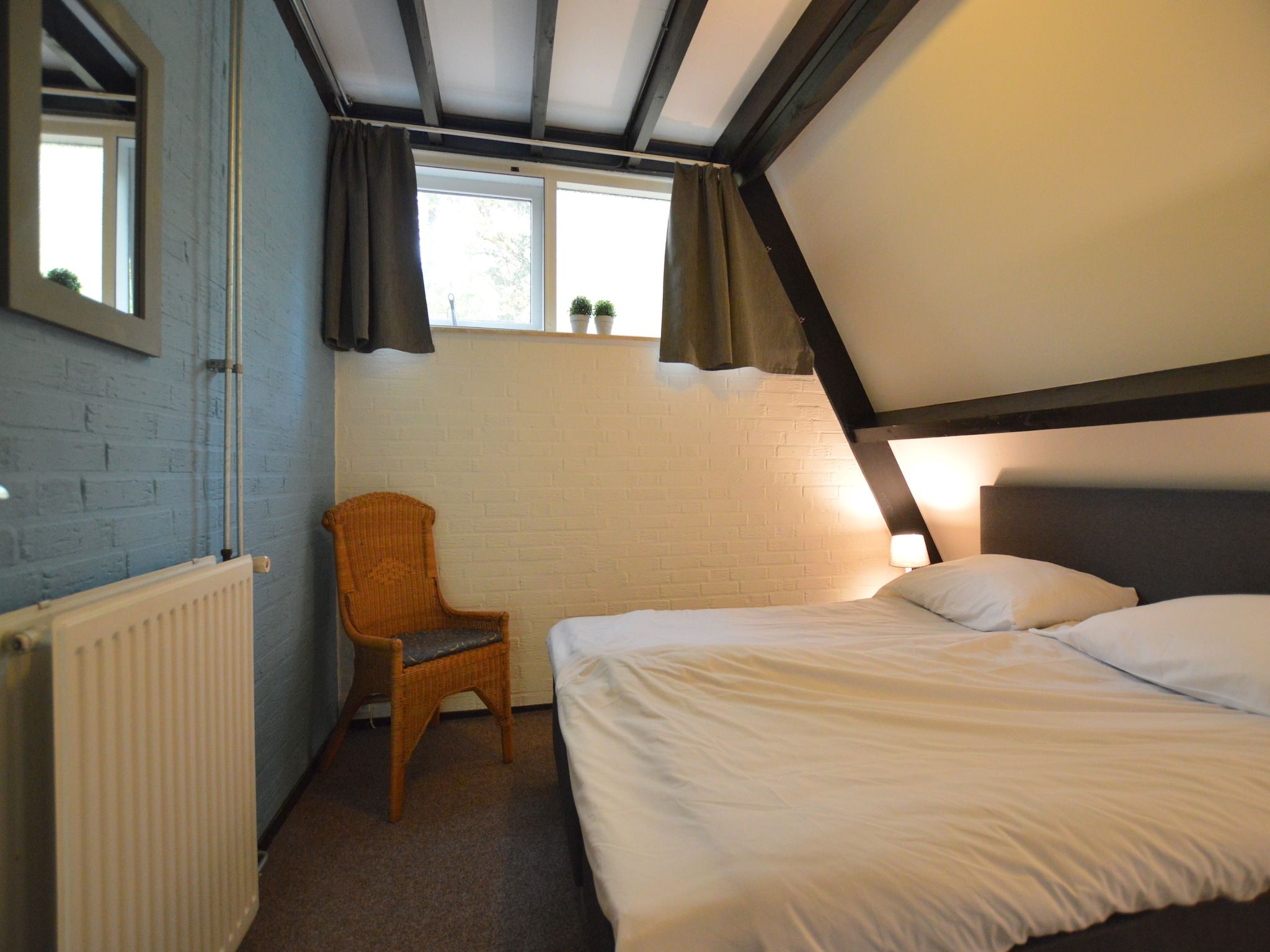 Een slaapkamer van Anjer Bungalow 61 in Stramproy